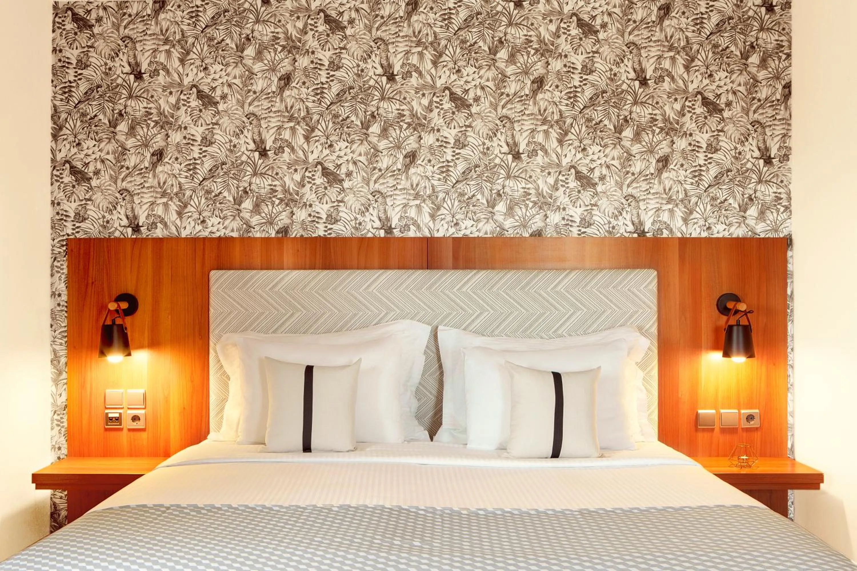 Bed in Zeus Essence Ramada by Wyndham Athens