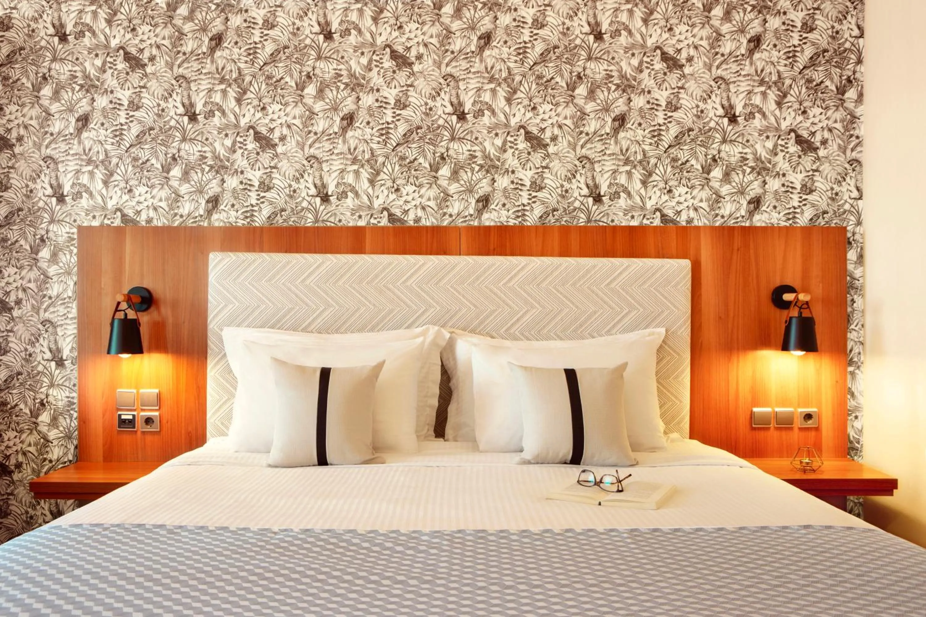 Bed in Zeus Essence Ramada by Wyndham Athens