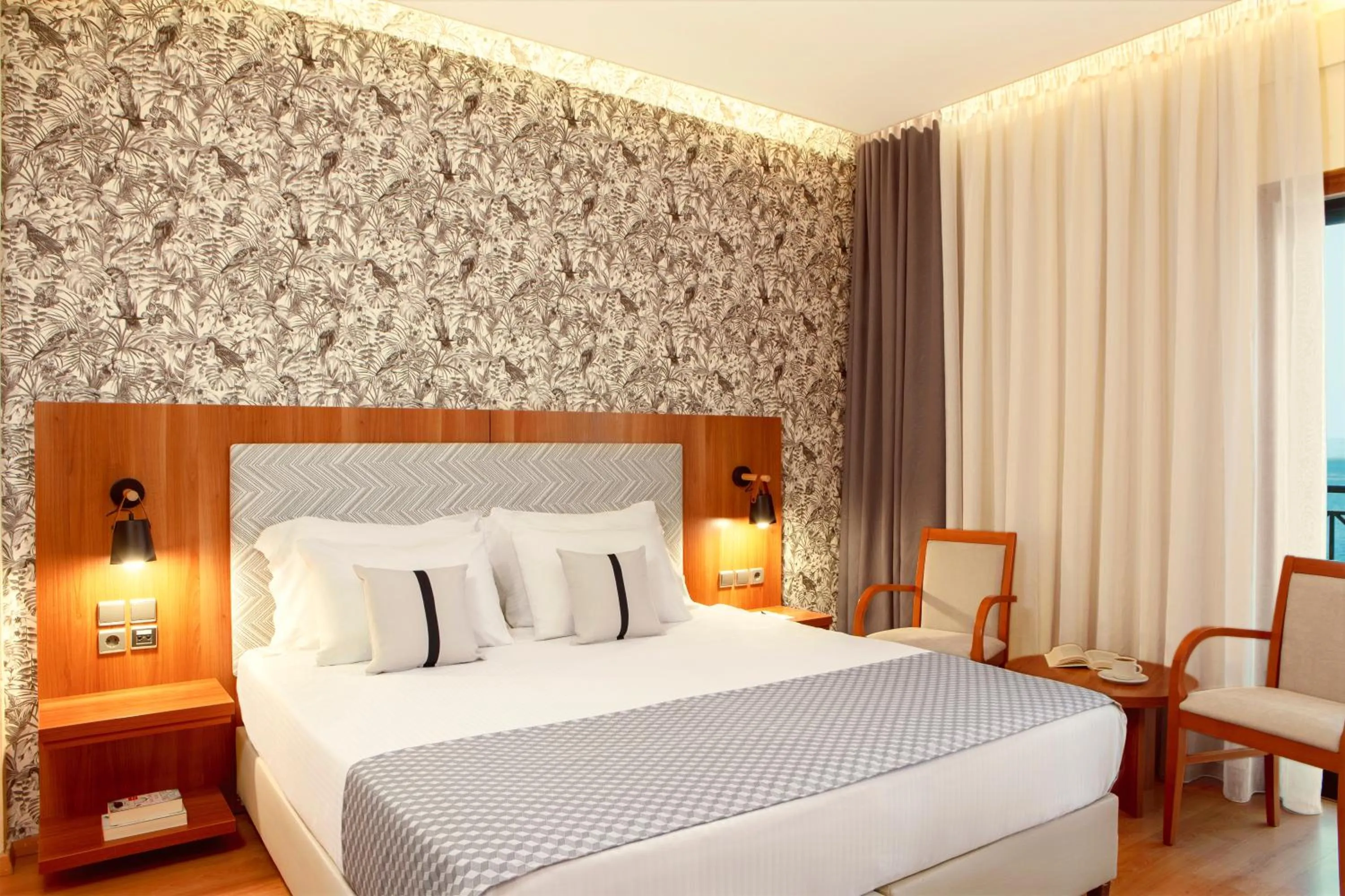 Bed in Zeus Essence Ramada by Wyndham Athens