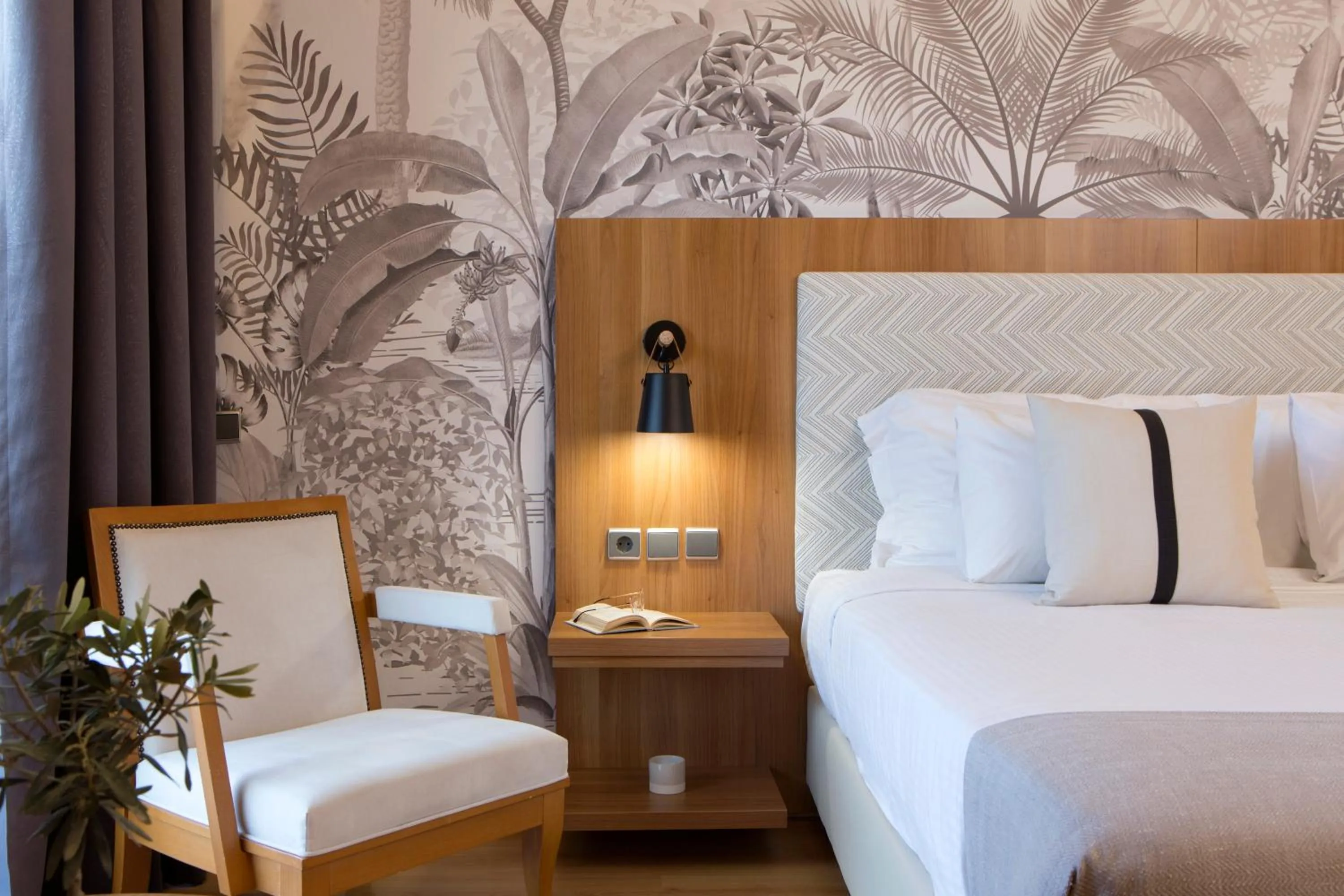 Bed in Zeus Essence Ramada by Wyndham Athens