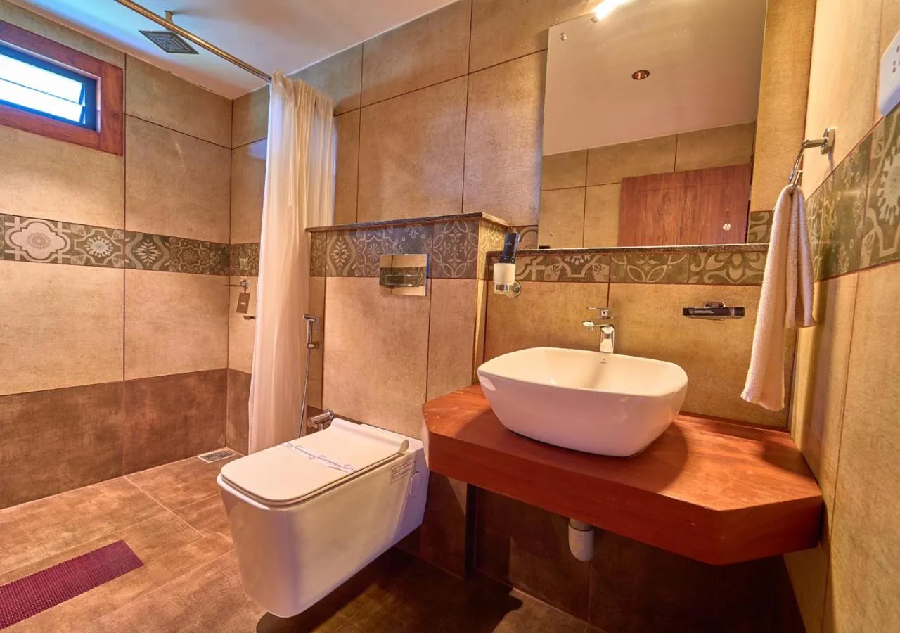 Shower in Niyatma Wayanad Pool Resort by VOYE HOMES - Inside Coffee Plantation
