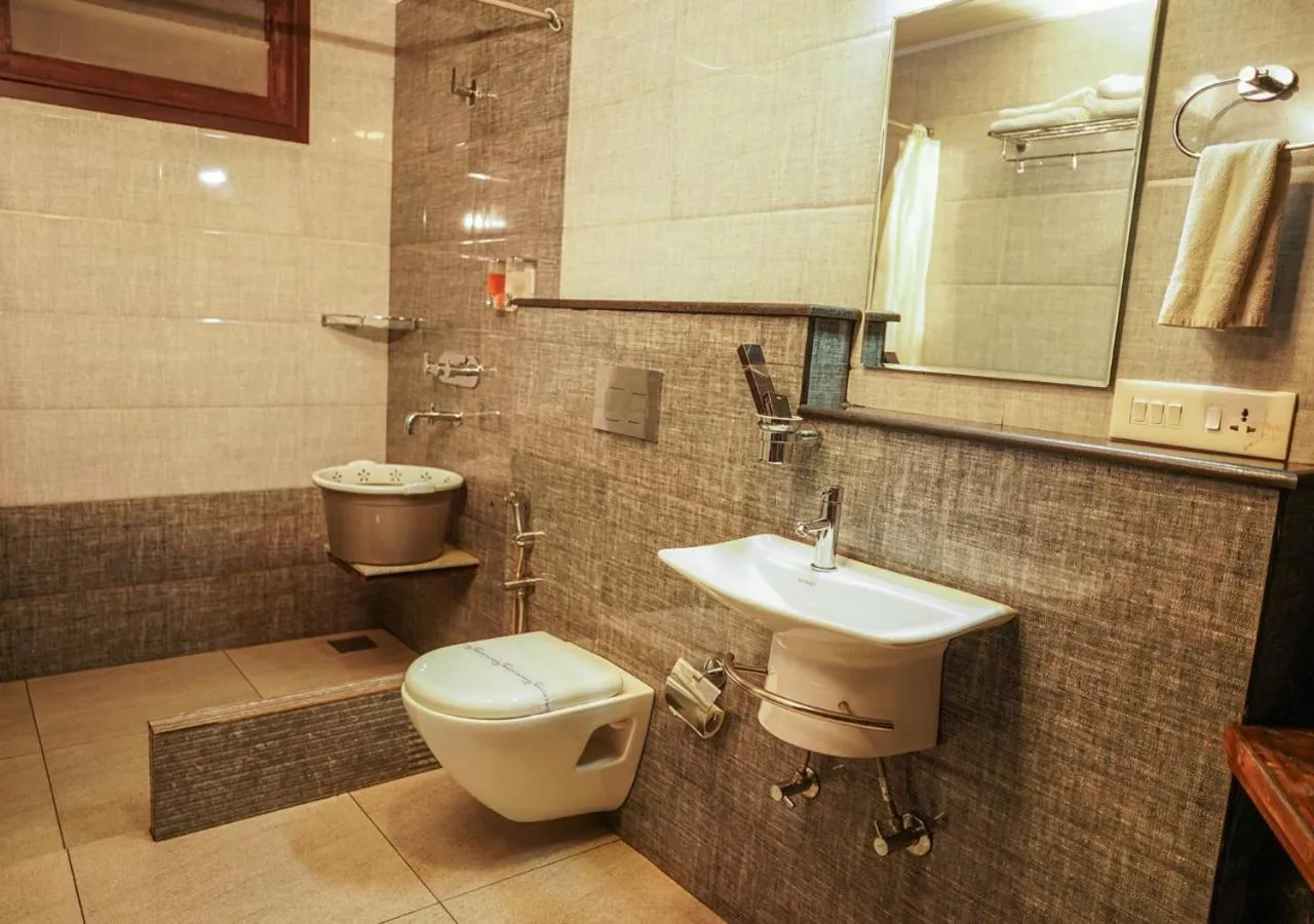 Toilet in Niyatma Wayanad Pool Resort by VOYE HOMES - Inside Coffee Plantation