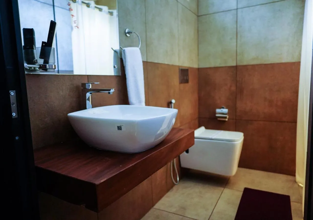 Toilet in Niyatma Wayanad Pool Resort by VOYE HOMES - Inside Coffee Plantation