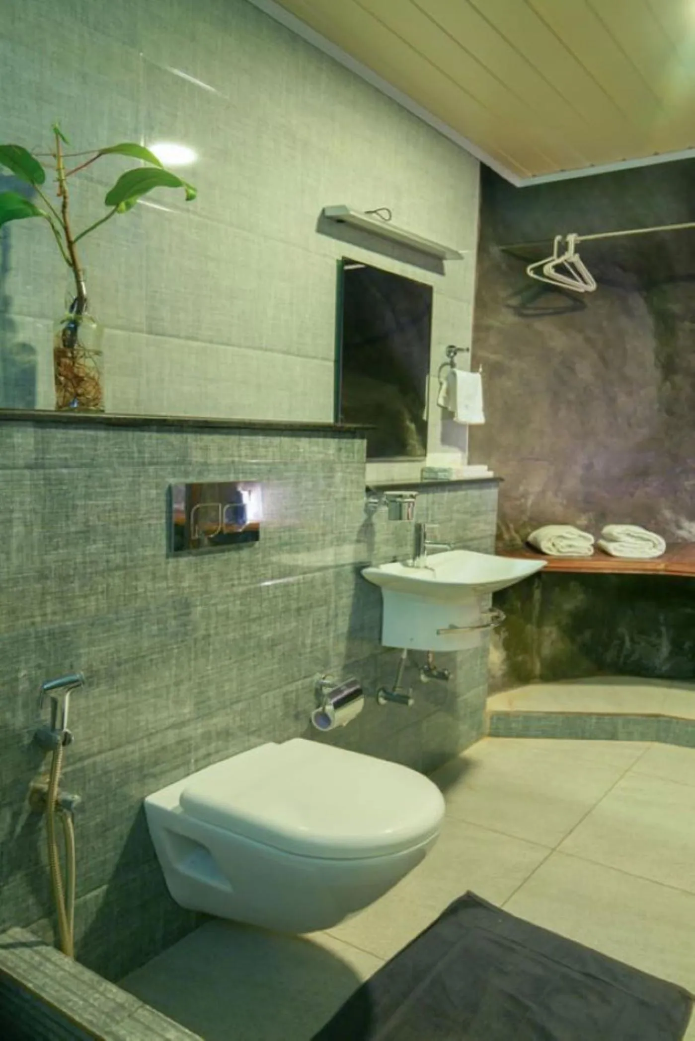 Bathroom in Niyatma Wayanad Pool Resort by VOYE HOMES - Inside Coffee Plantation