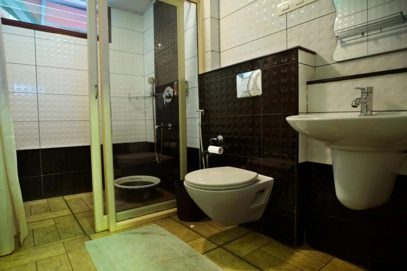 Bathroom in Niyatma Wayanad Pool Resort by VOYE HOMES - Inside Coffee Plantation