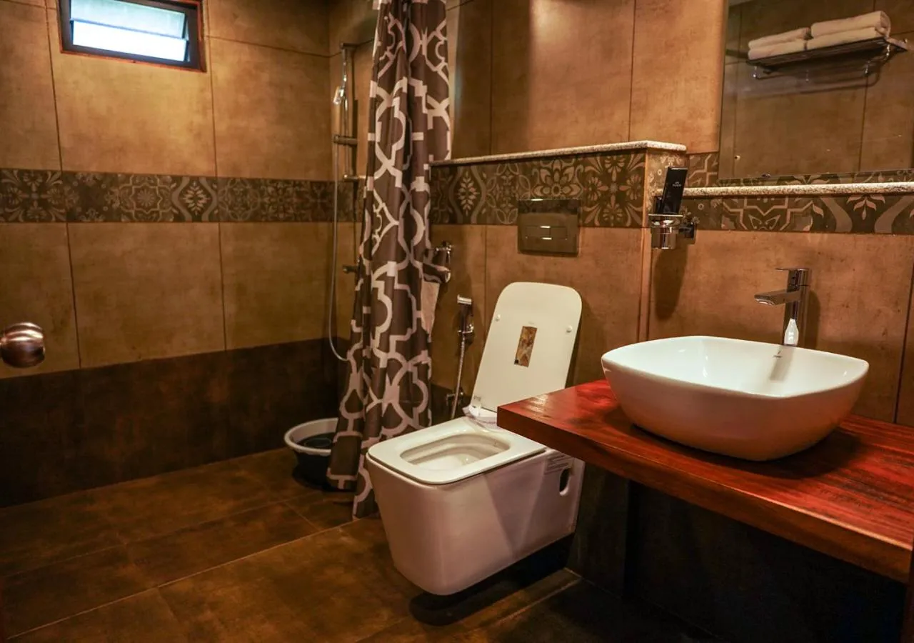 Shower in Niyatma Wayanad Pool Resort by VOYE HOMES - Inside Coffee Plantation