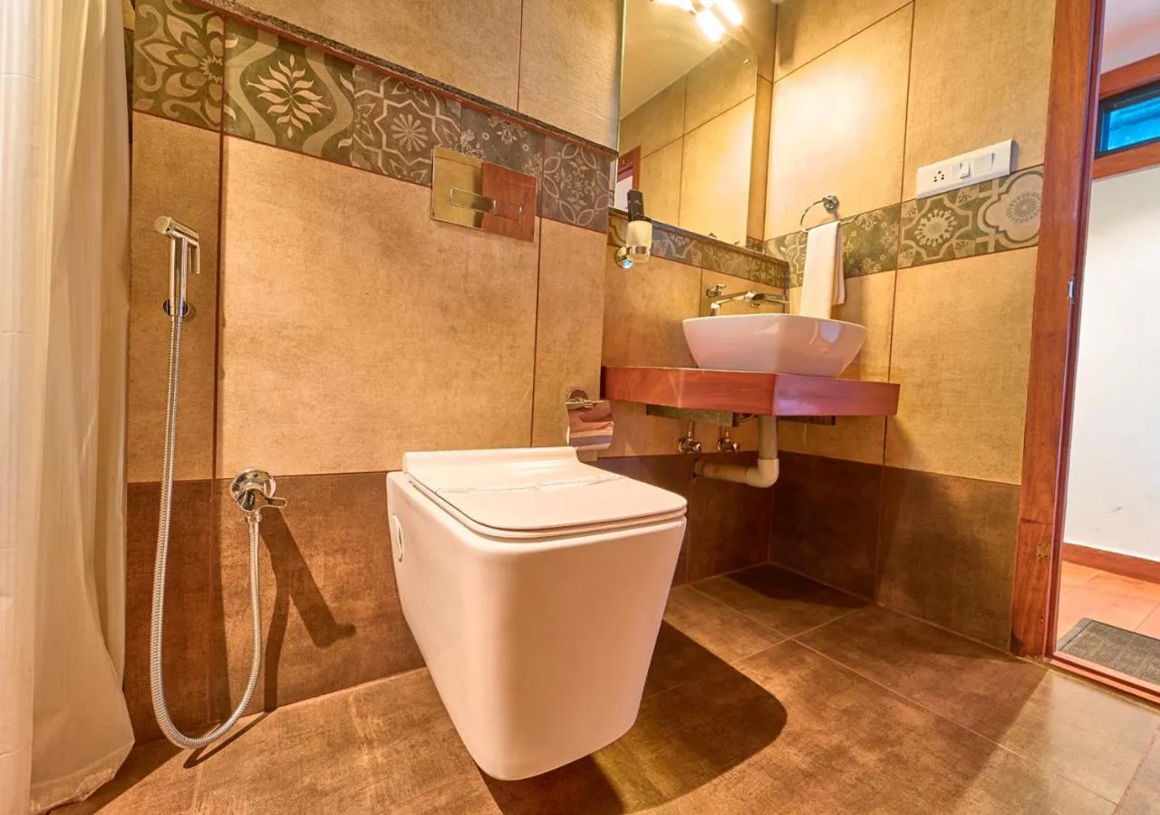 Shower in Niyatma Wayanad Pool Resort by VOYE HOMES - Inside Coffee Plantation