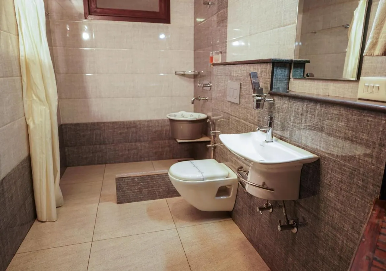 Shower in Niyatma Wayanad Pool Resort by VOYE HOMES - Inside Coffee Plantation