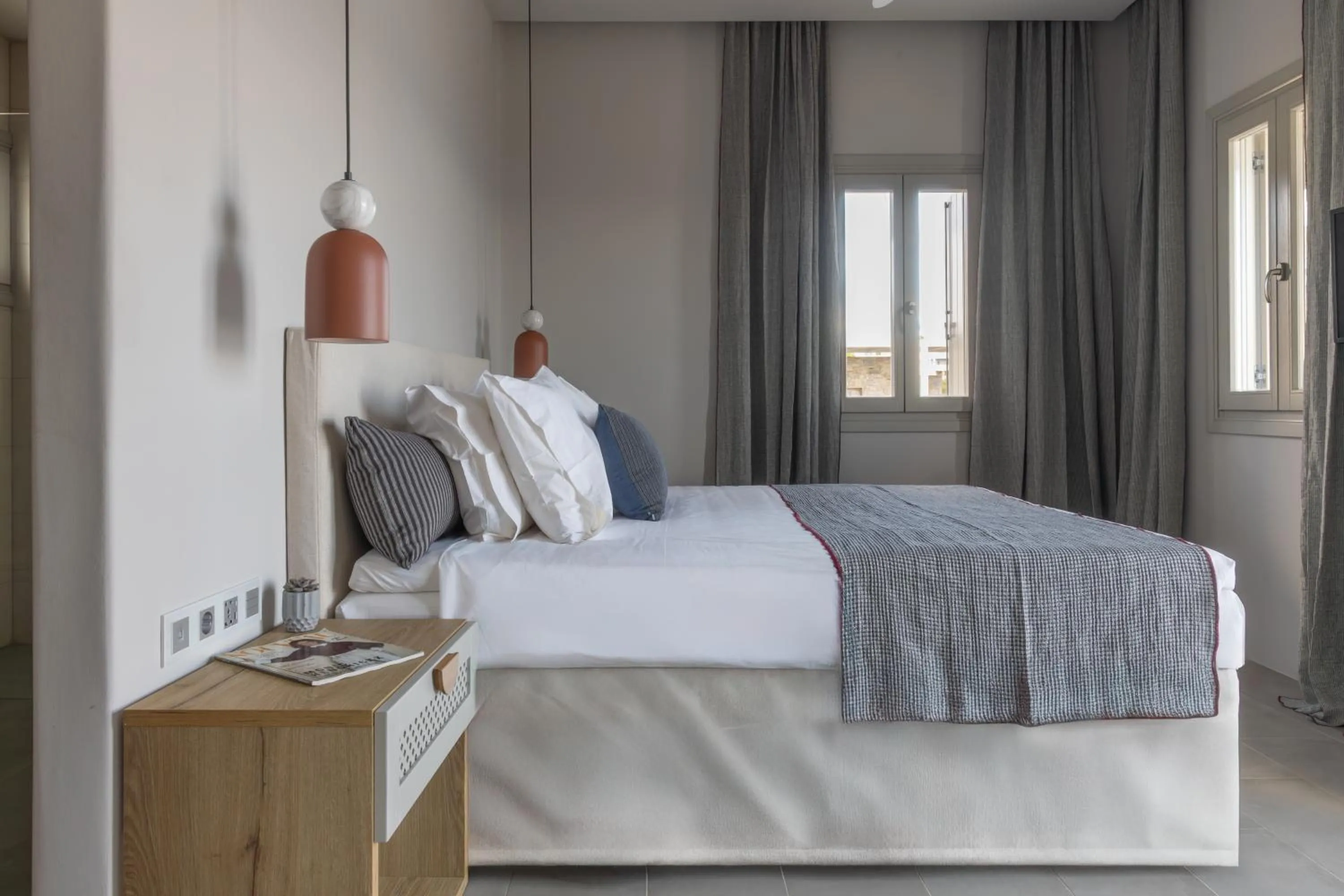 Bed in Poseidon of Paros Hotel & Spa