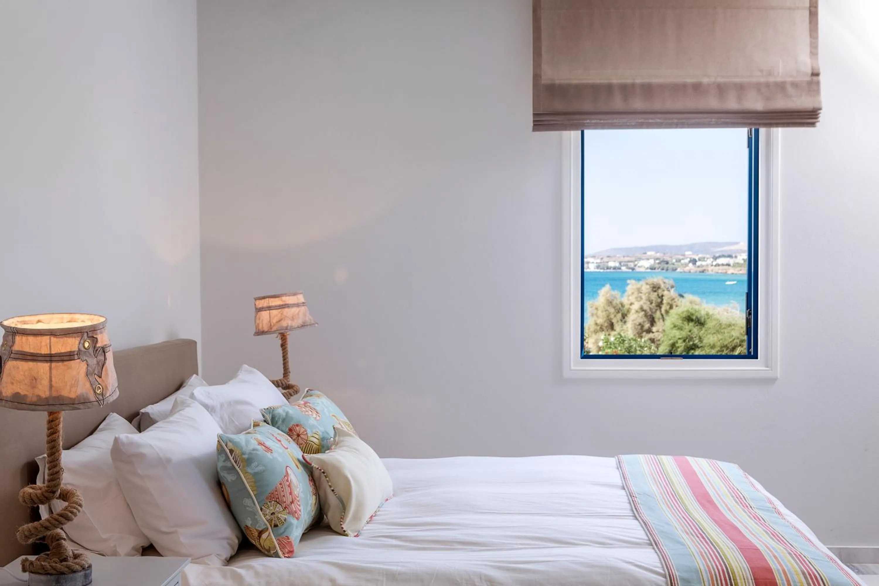 Bed in Poseidon of Paros Hotel & Spa
