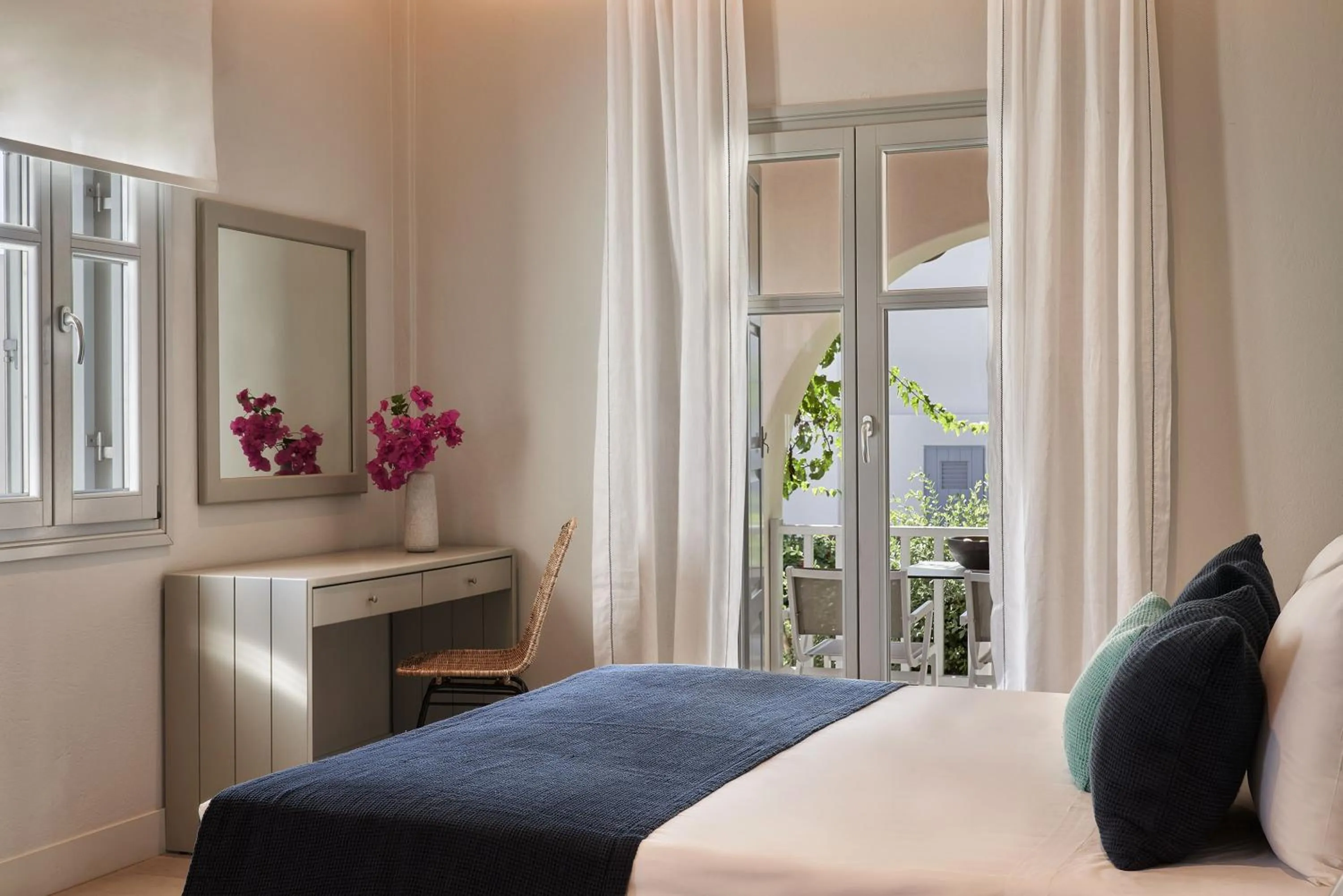 Bed in Poseidon of Paros Hotel & Spa