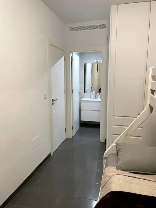 Bed in Modern Apartment with pool area