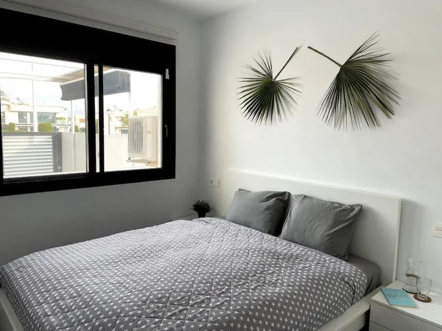 Bed in Modern Apartment with pool area