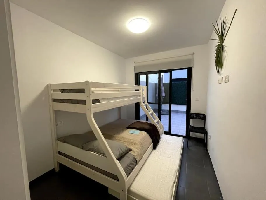 Bed in Modern Apartment with pool area
