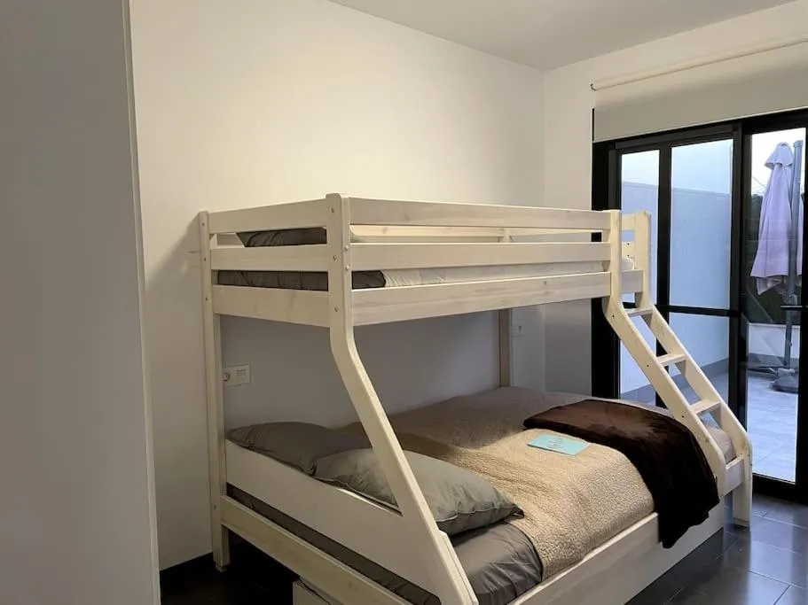 Bed in Modern Apartment with pool area