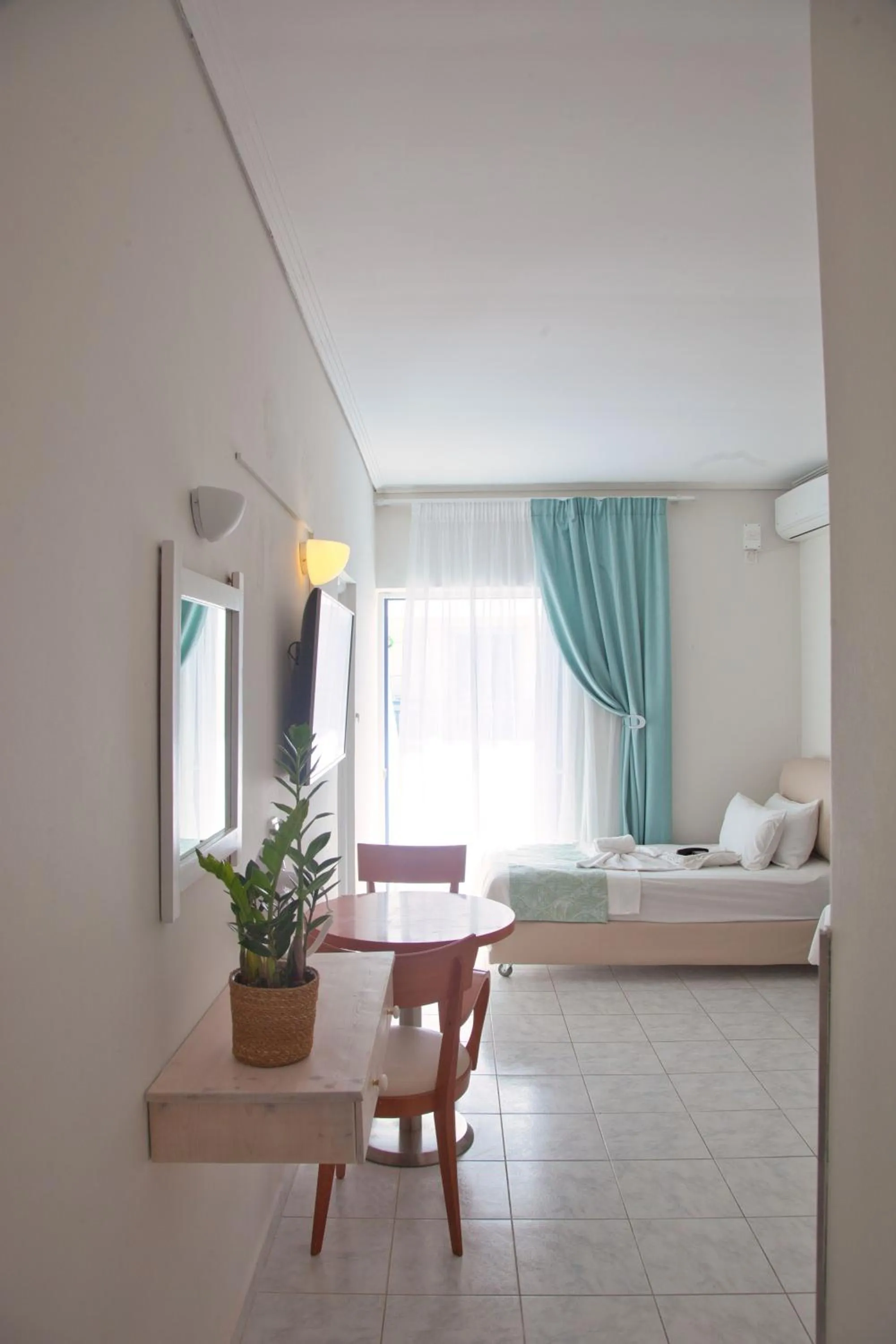 Photo of the whole room, Bed in The Milos