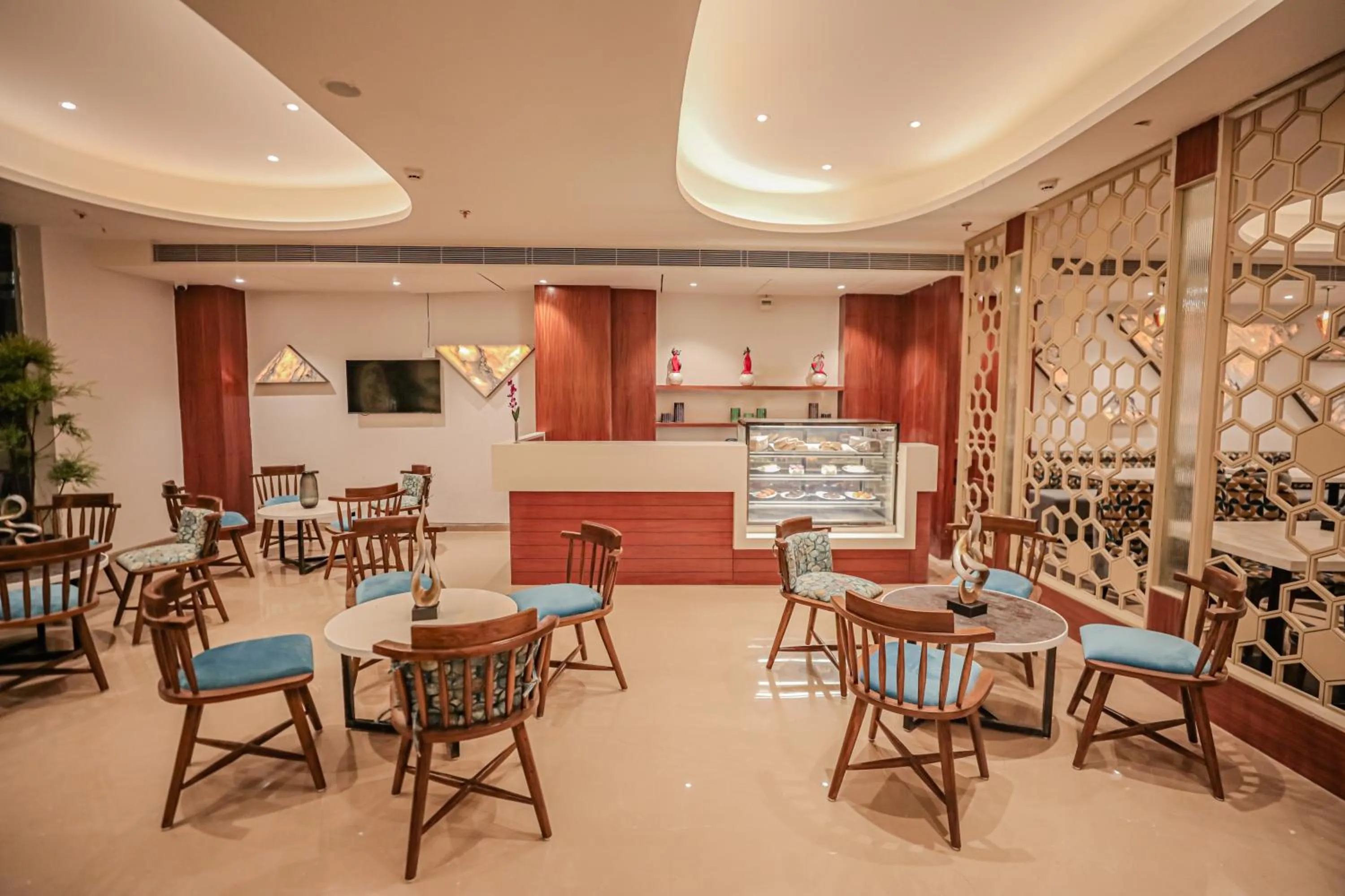 Communal lounge/ TV room in Regenta Place Bhopal by Royal Orchid Hotels Limited