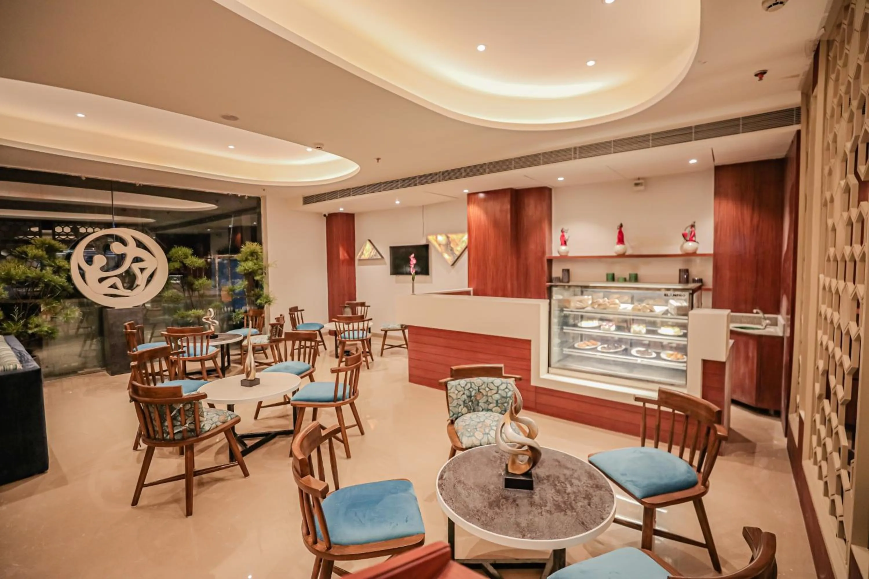 Communal lounge/ TV room in Regenta Place Bhopal by Royal Orchid Hotels Limited