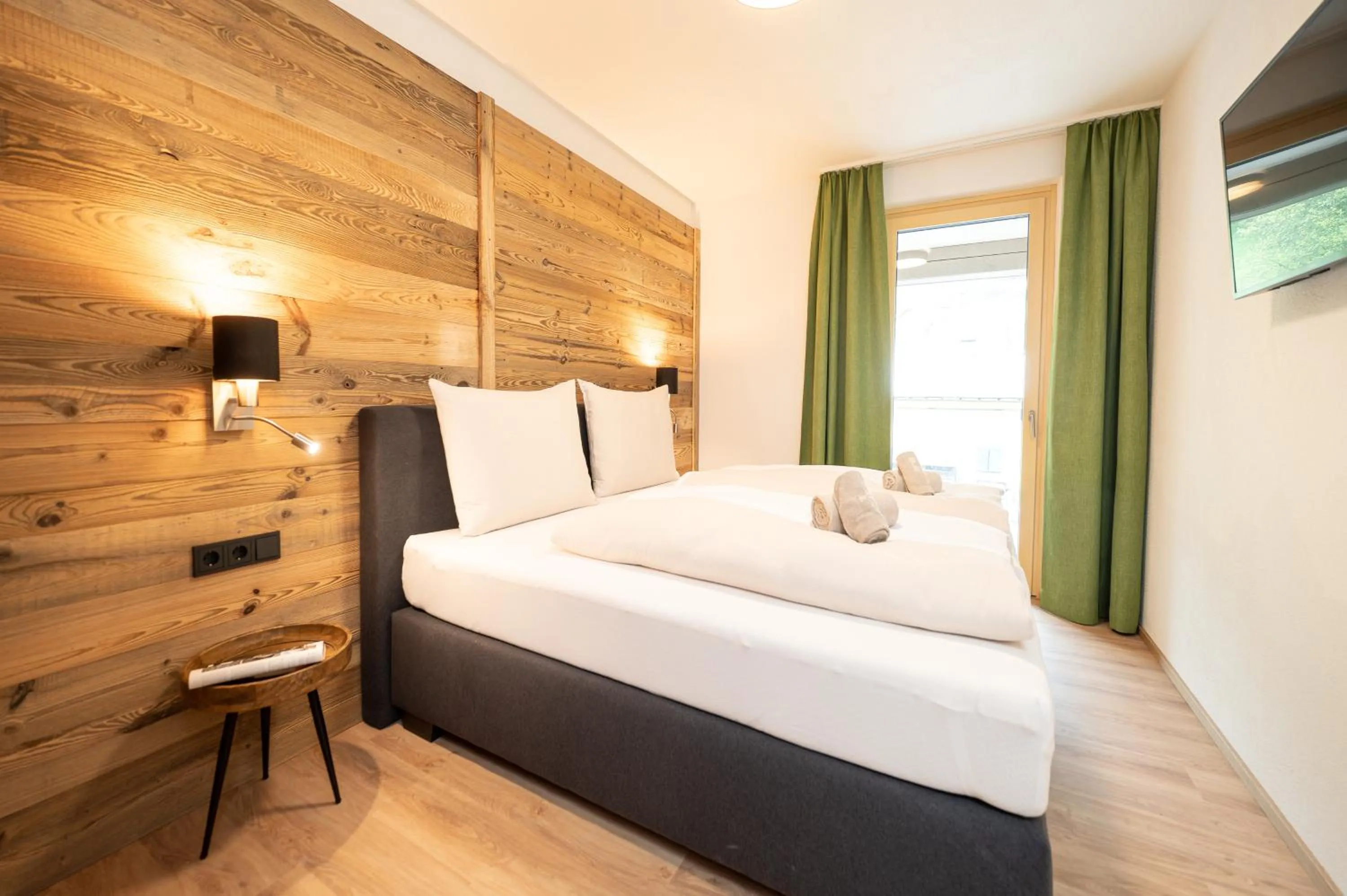 Bedroom, Bed in AlpenParks Wildbach Lodge Hochkönig