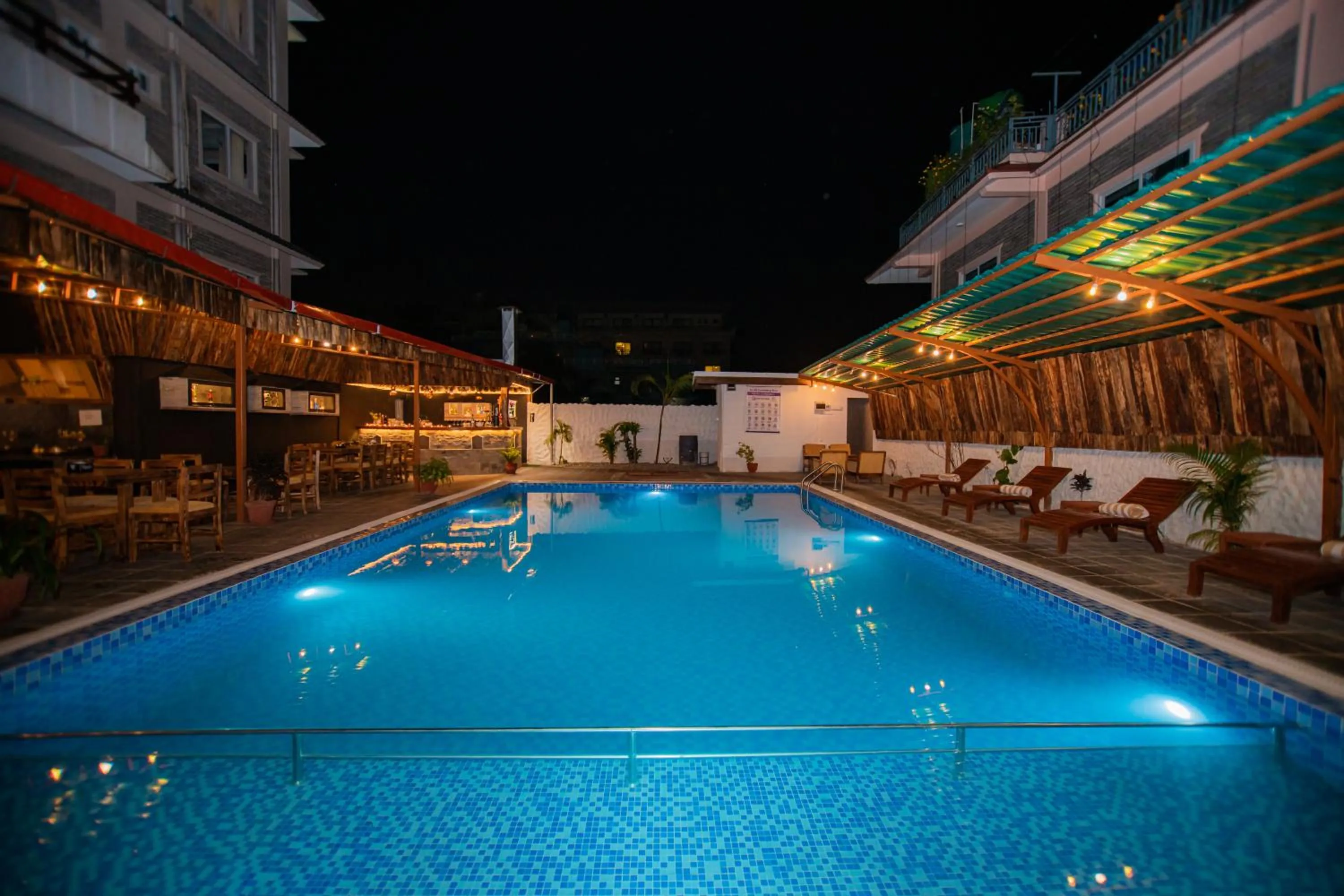 Swimming pool in Majheri Resort and Spa