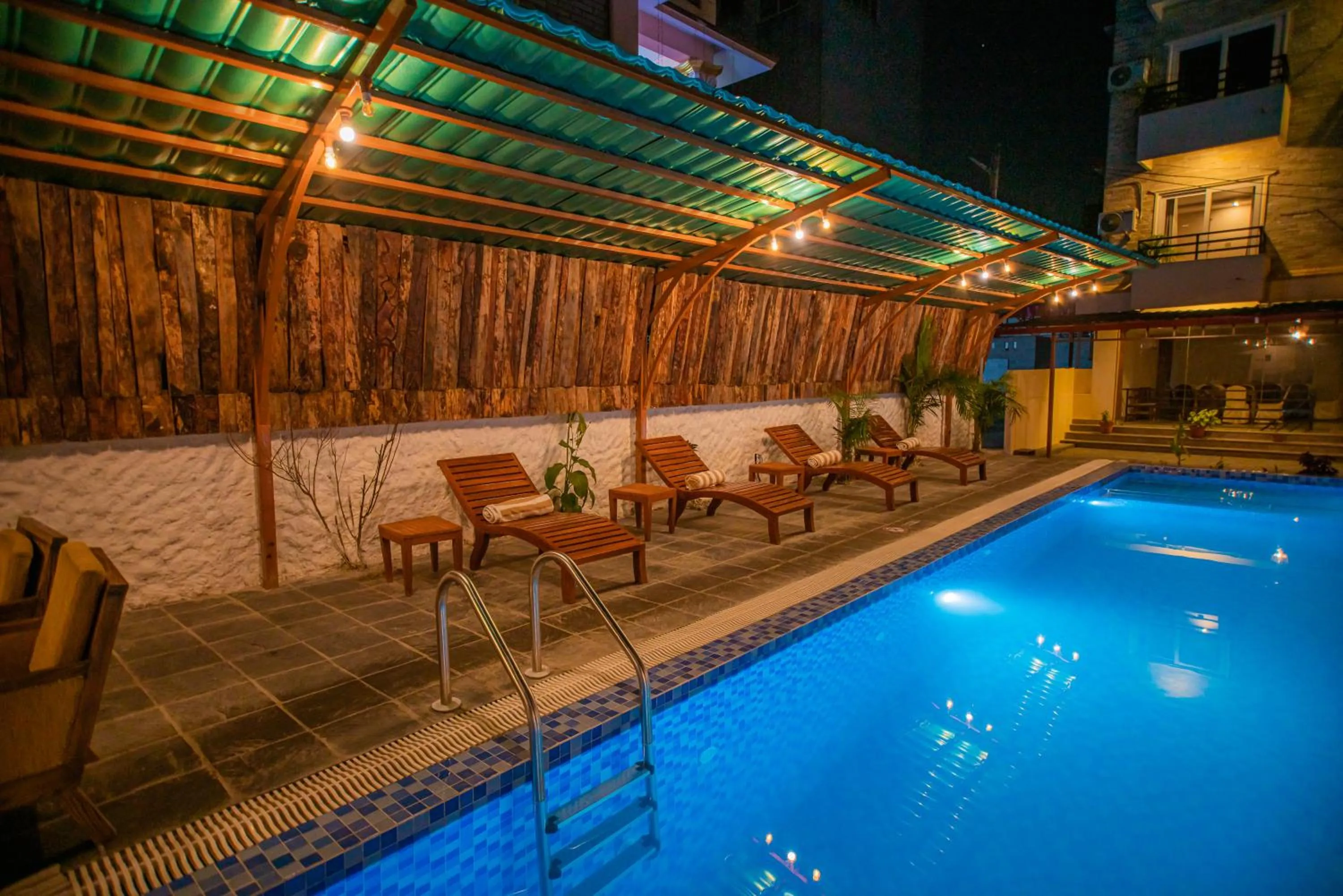 Swimming pool in Majheri Resort and Spa