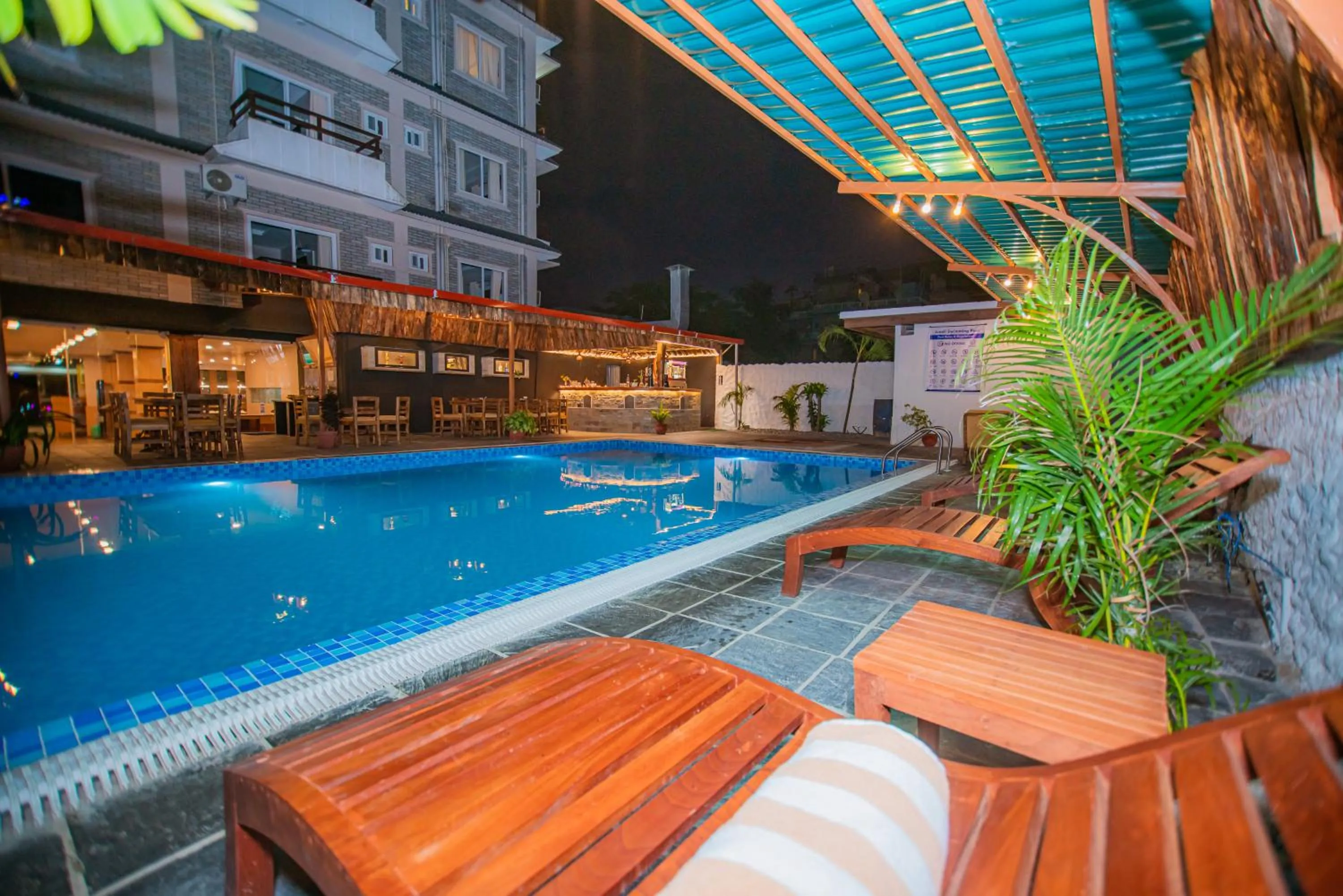 Swimming pool in Majheri Resort and Spa