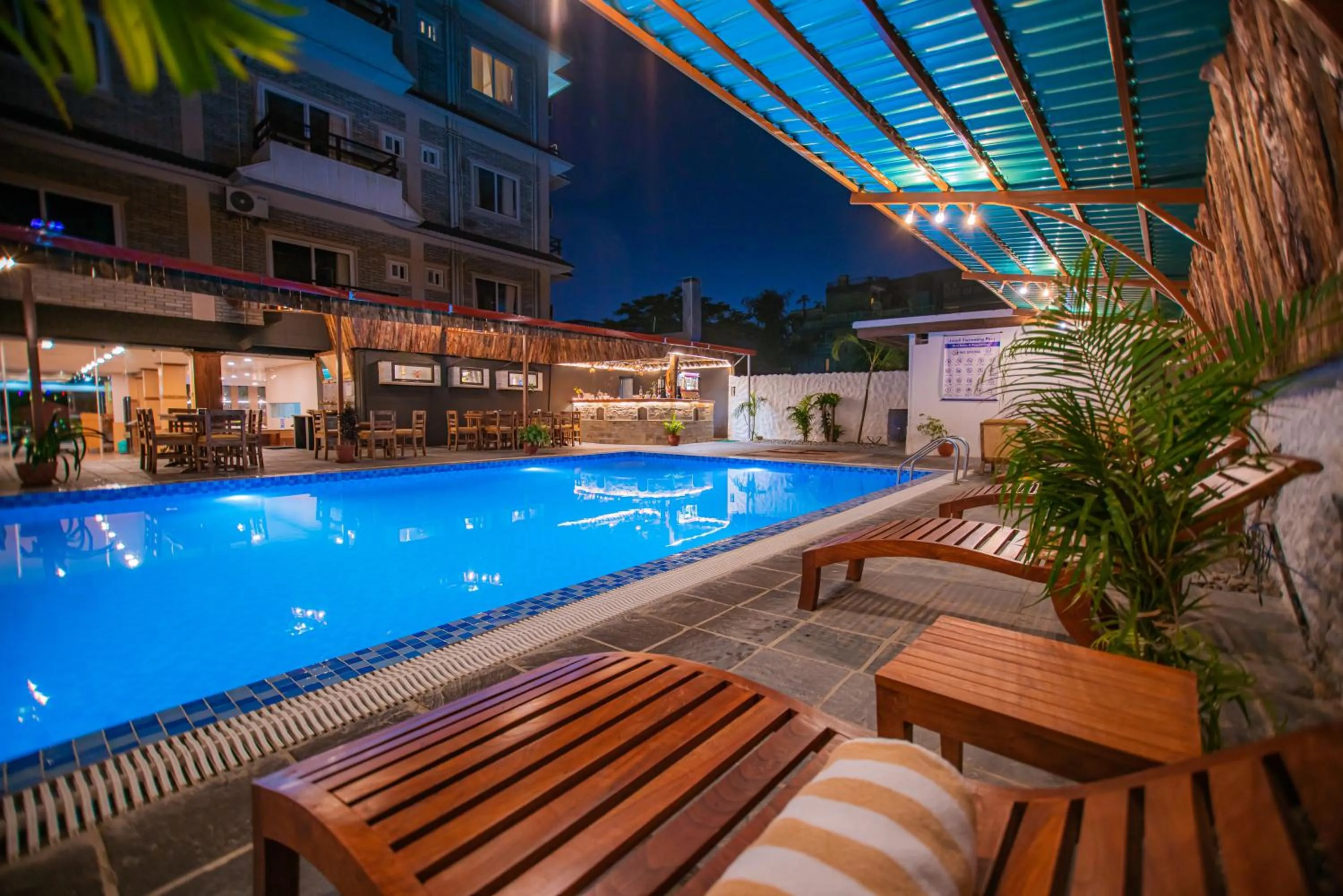 Swimming pool in Majheri Resort and Spa