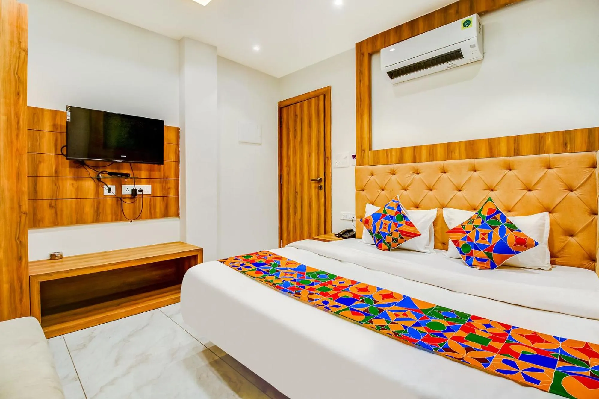 Bed in FabHotel Prime Purple Orchid