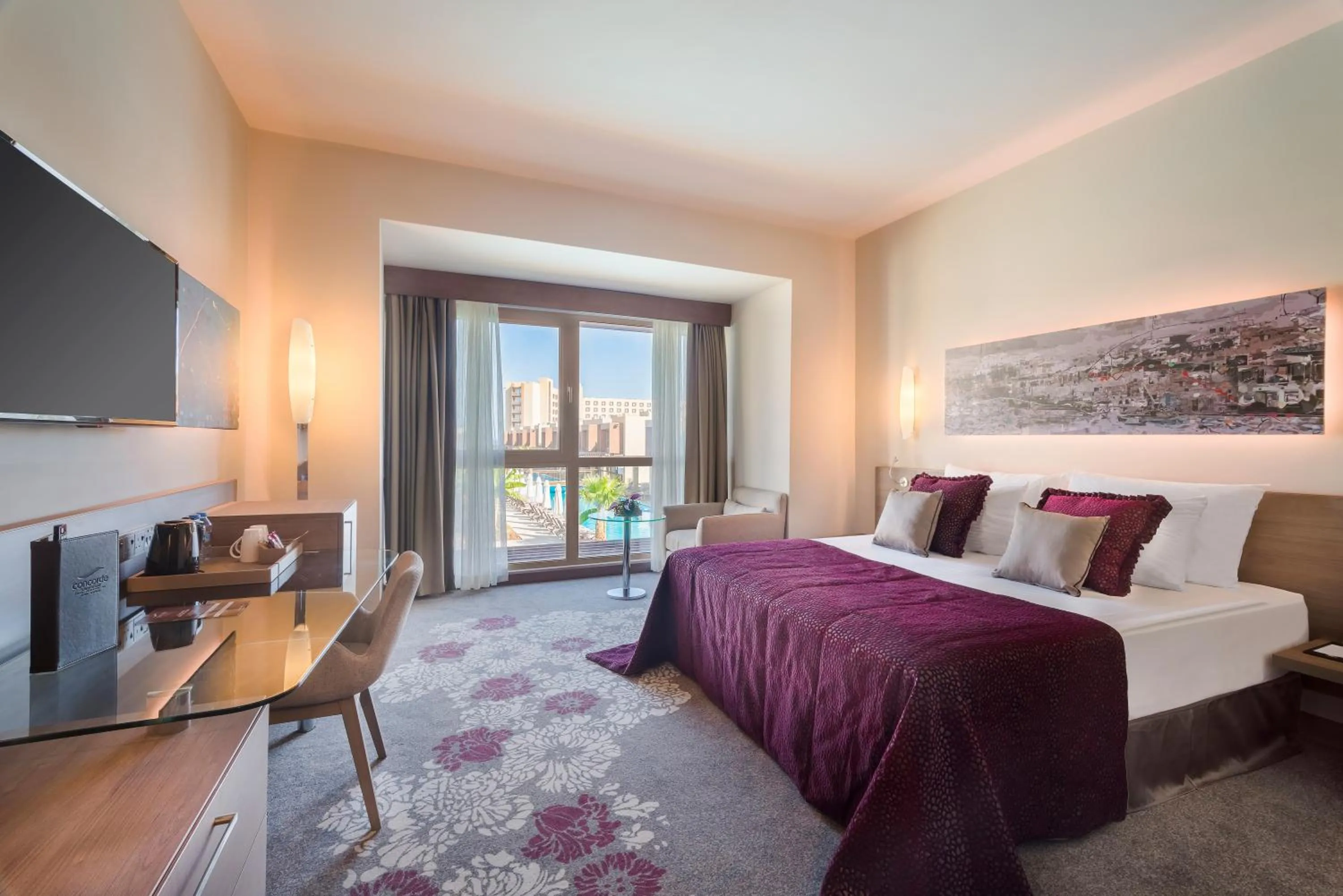 Communal lounge/ TV room, Bed in Concorde Luxury Resort & Casino