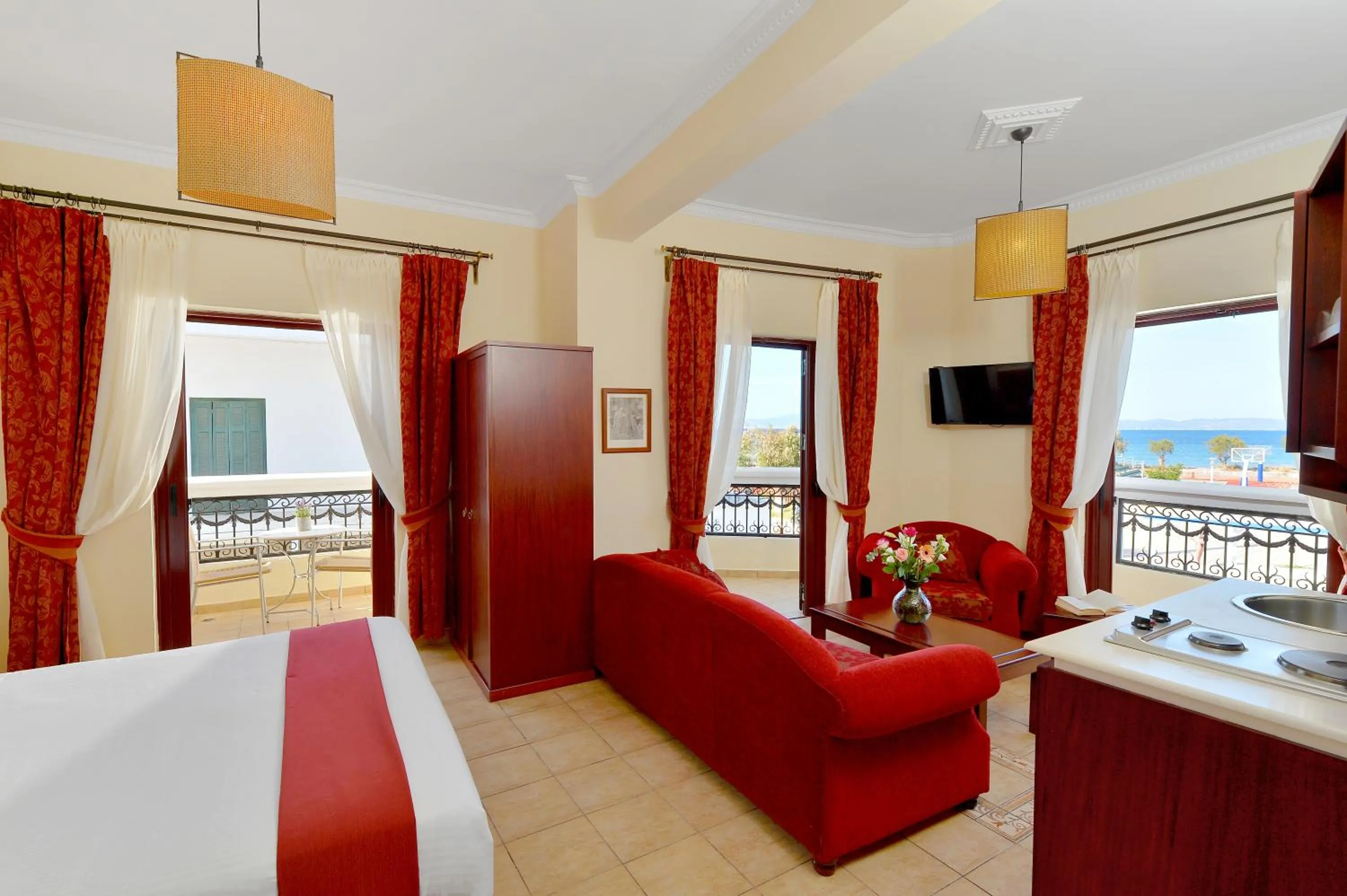 Communal lounge/ TV room, Bed in Agistri Hotel