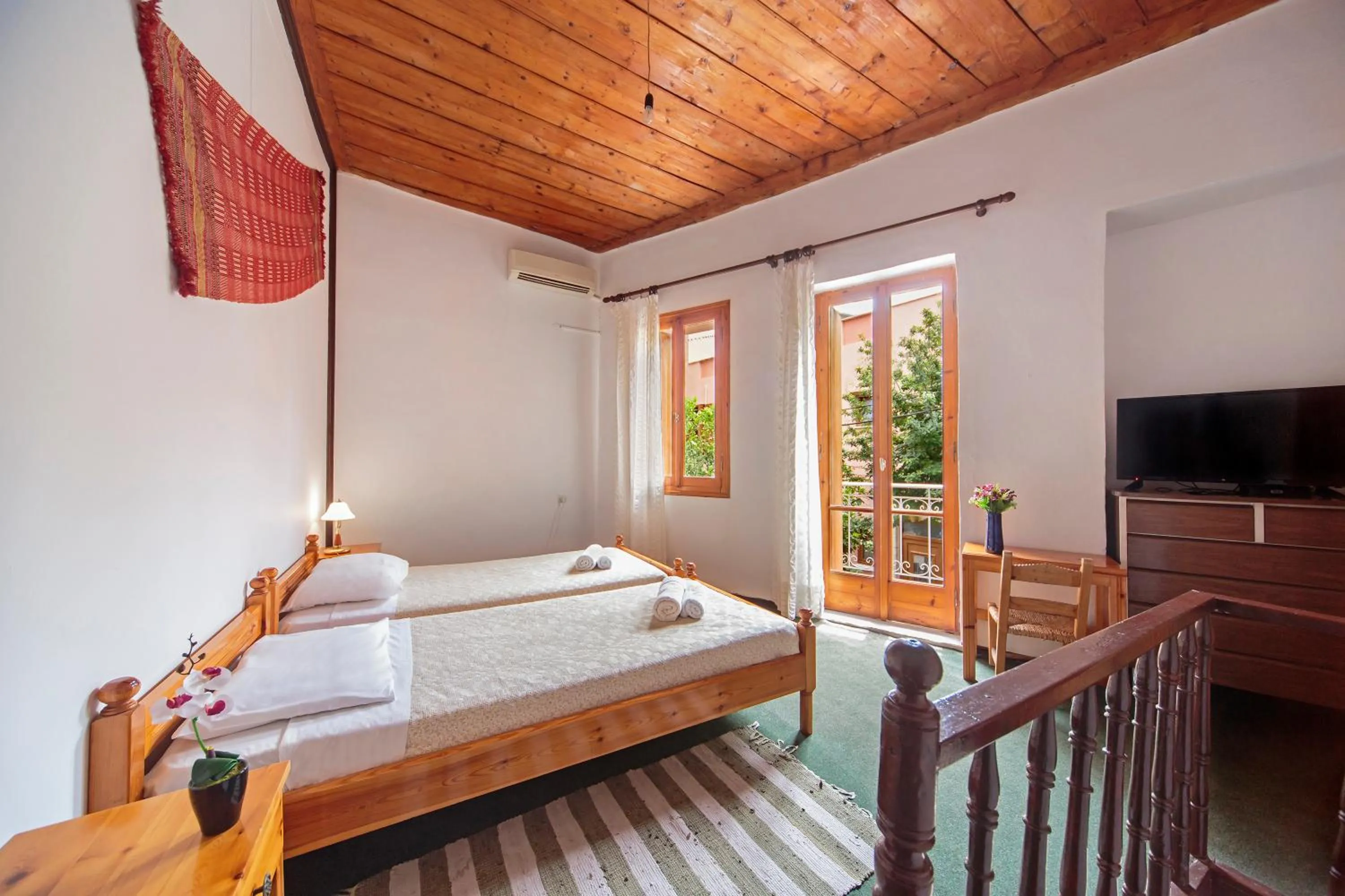 Bedroom in KasteliSuites