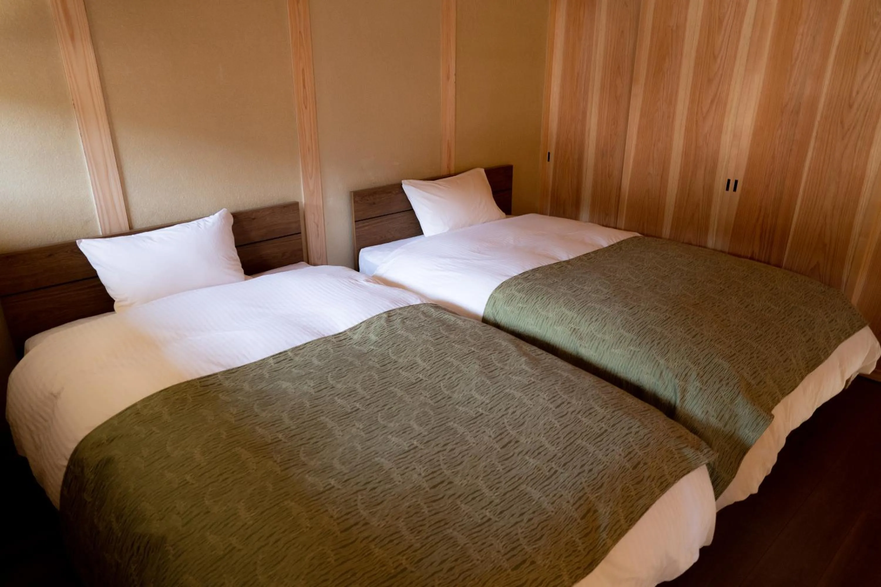 Bed in Satoyama Hotel Kanenone Tamba