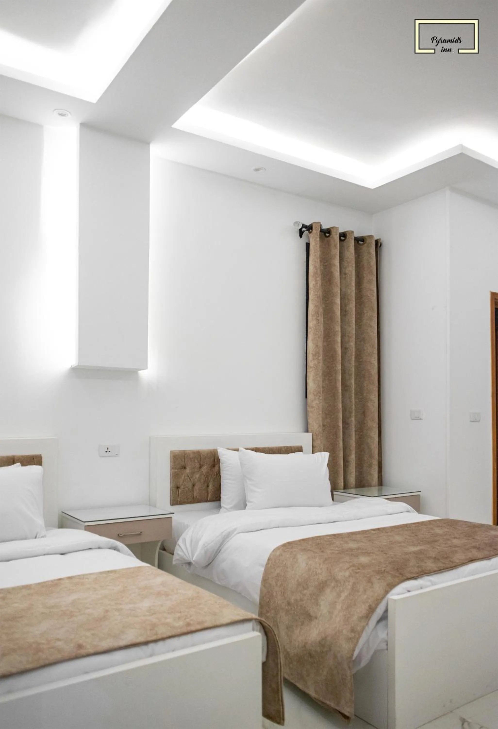 Bedroom in PR Pyramids Inn