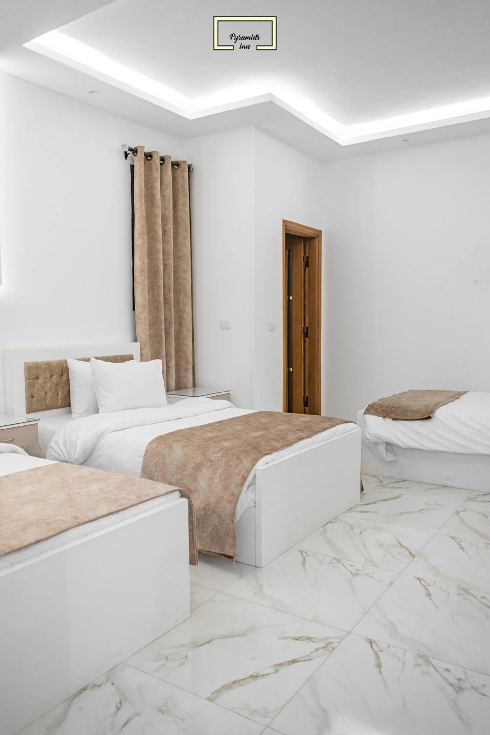 Bedroom in PR Pyramids Inn