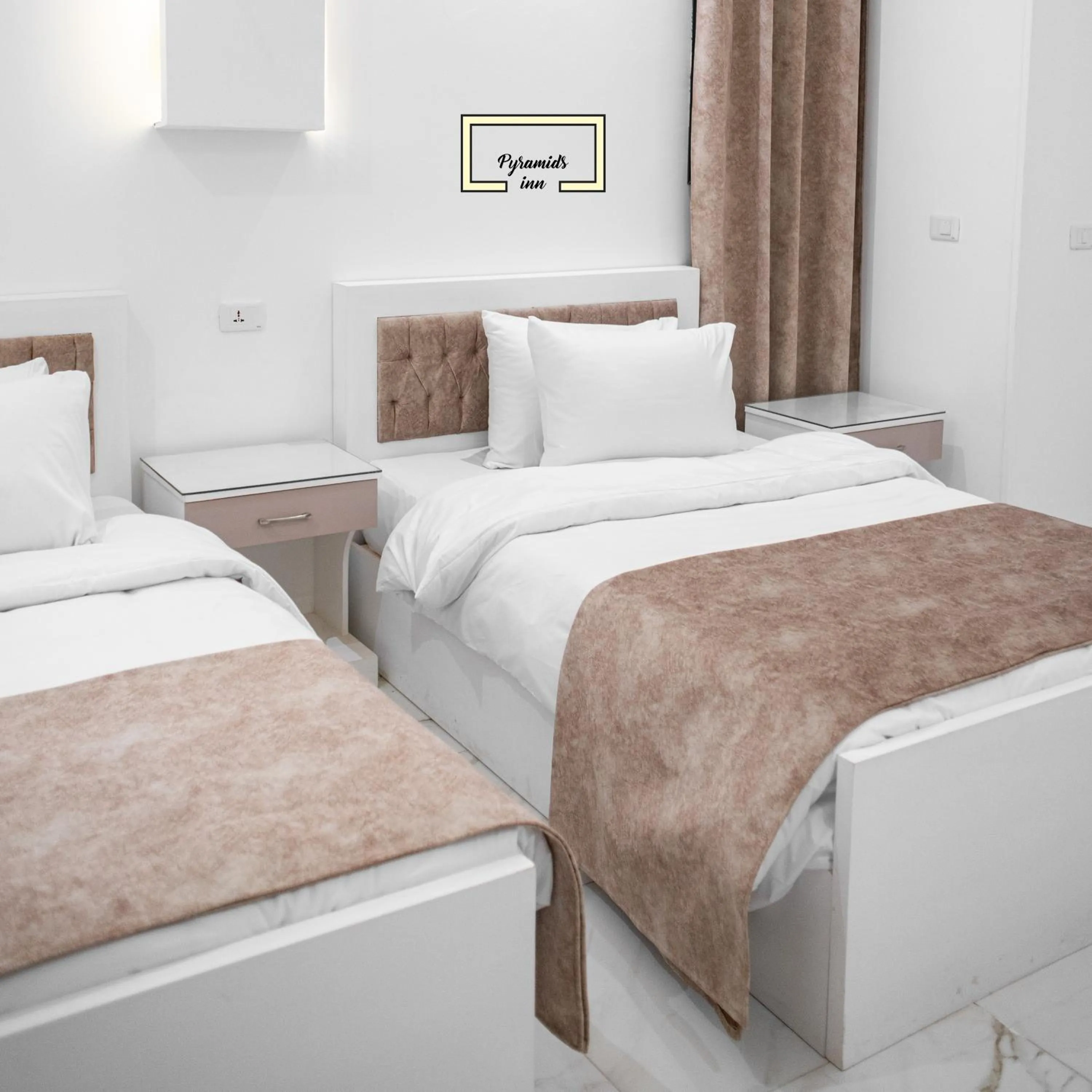 Bedroom in PR Pyramids Inn