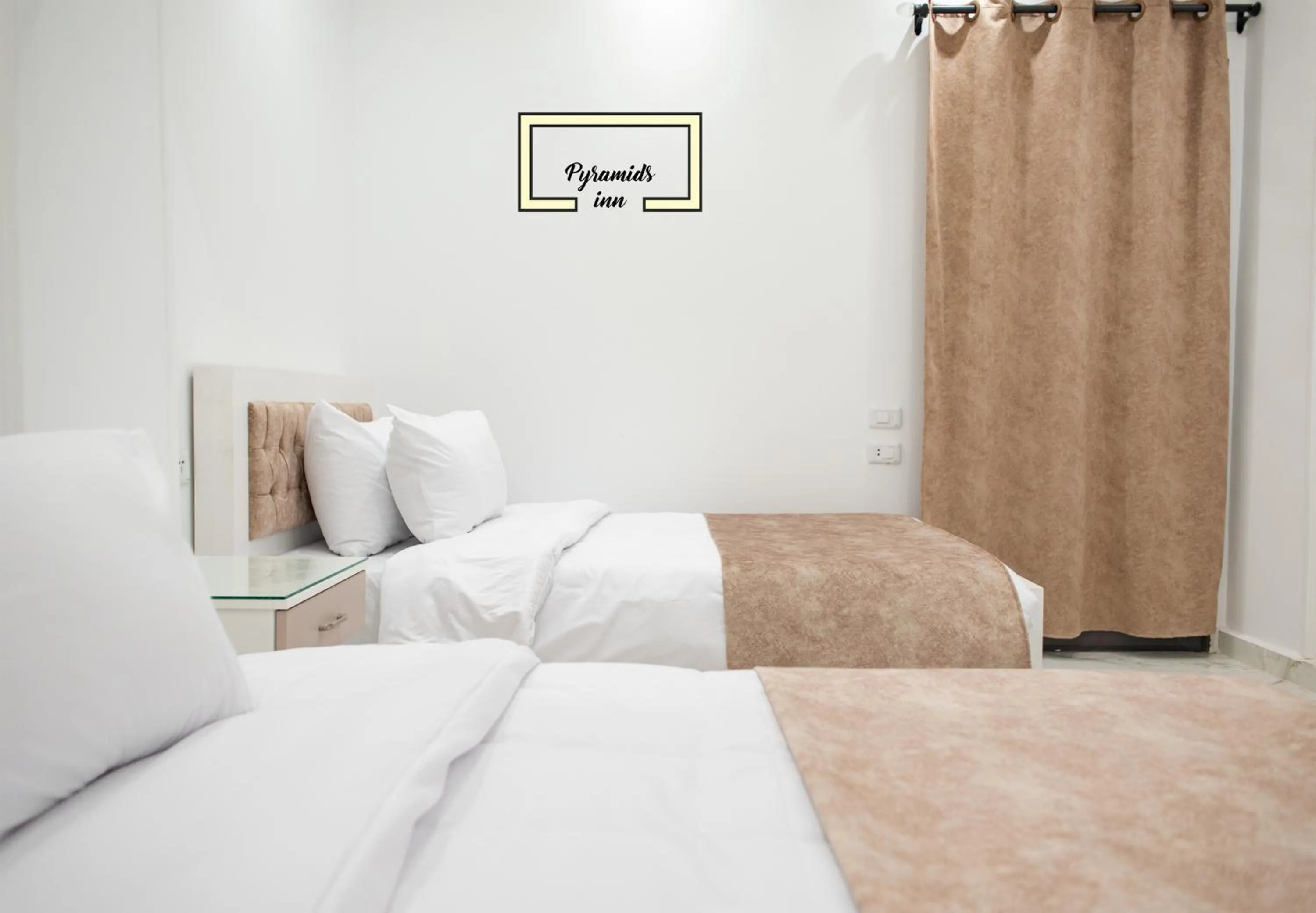 Bedroom in PR Pyramids Inn