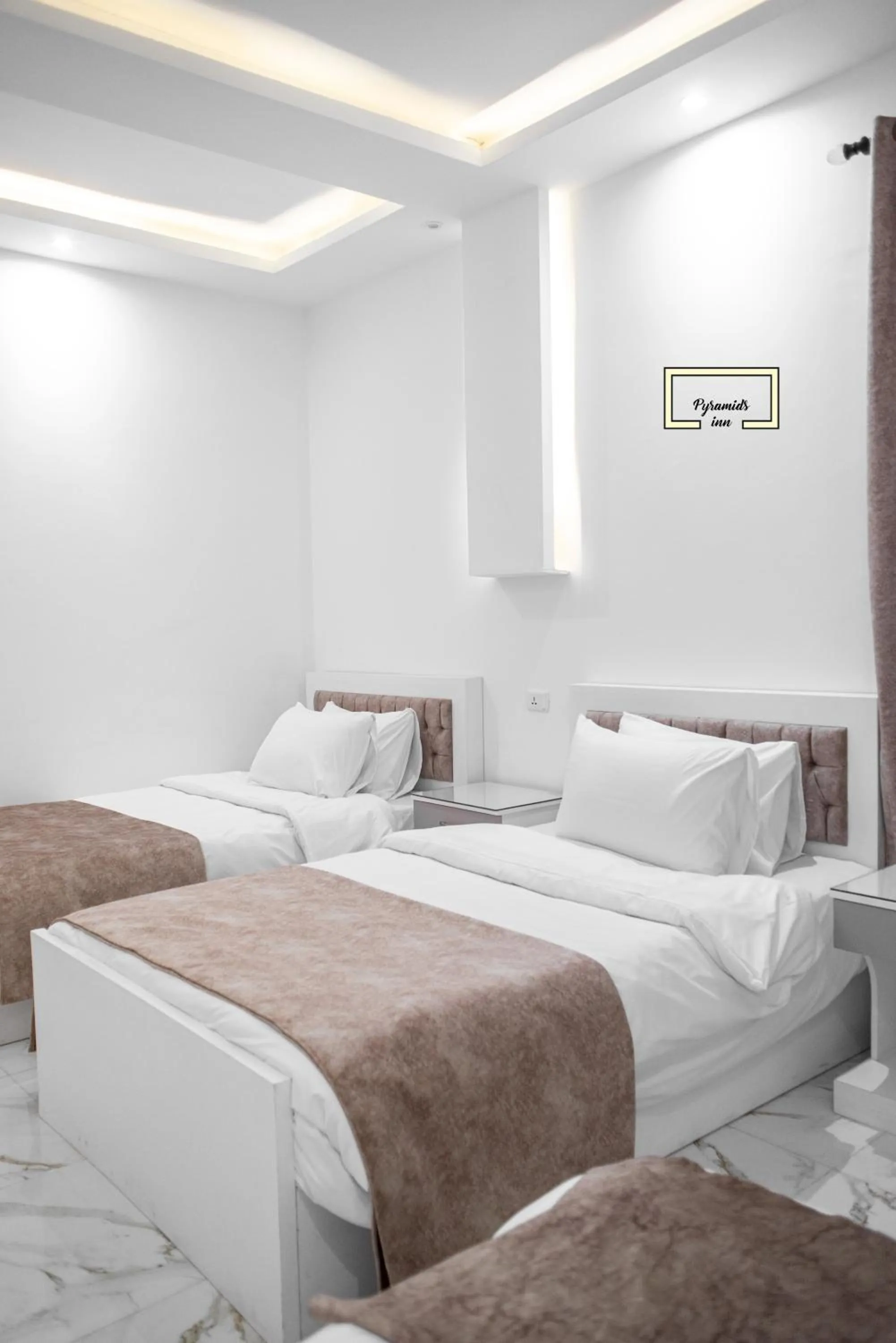 Bedroom in PR Pyramids Inn