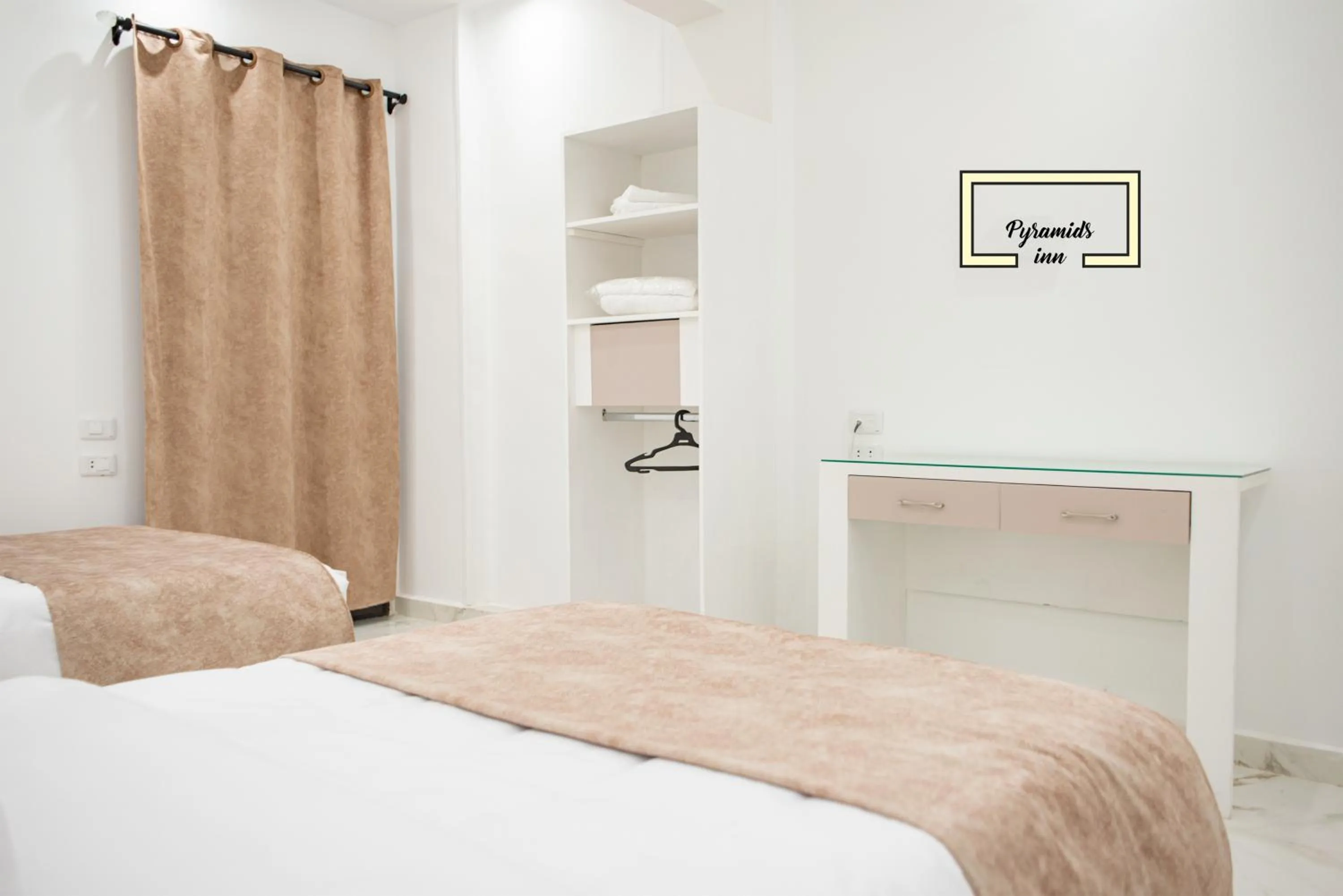 Bedroom in PR Pyramids Inn