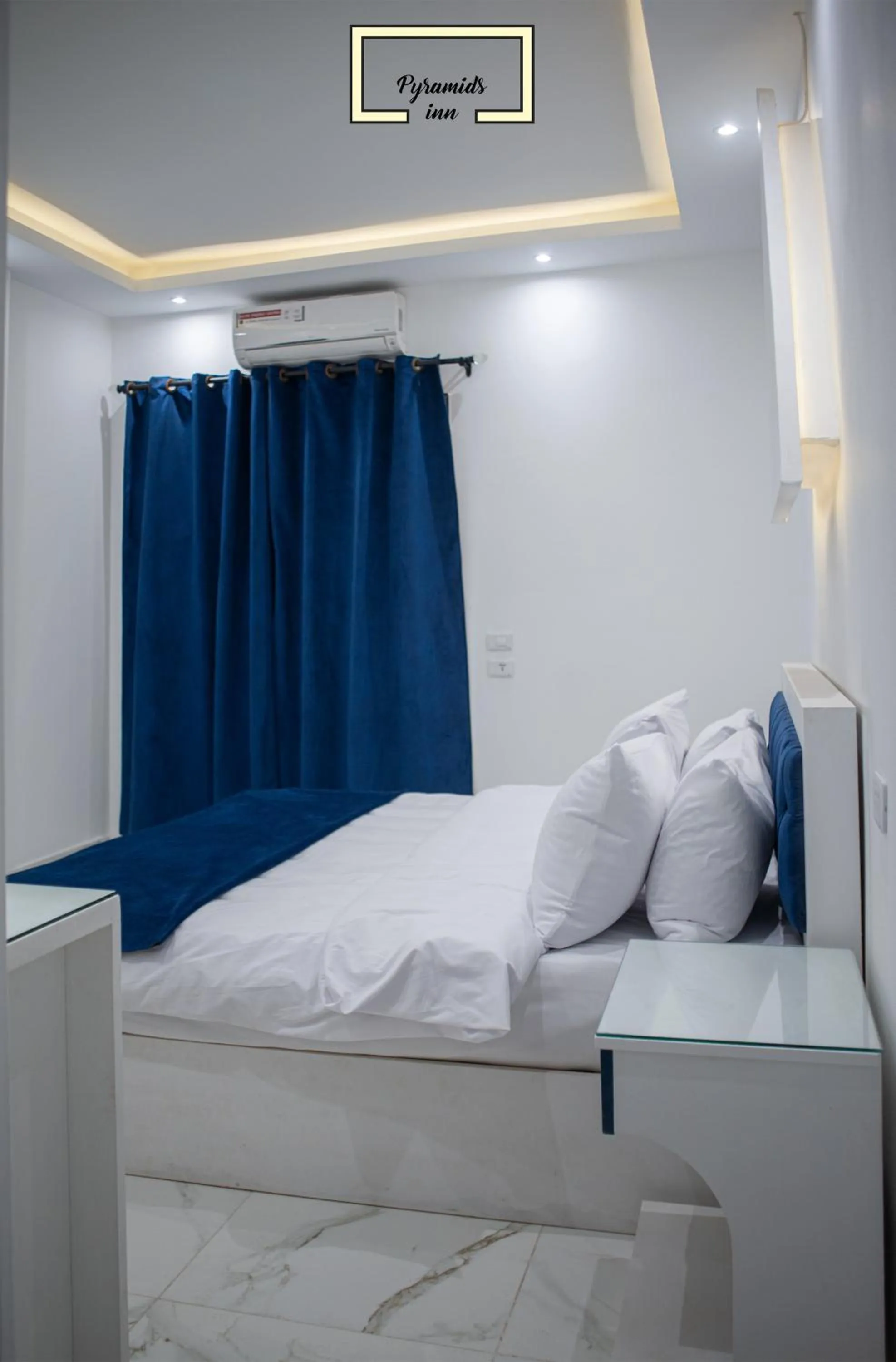 Bedroom in PR Pyramids Inn