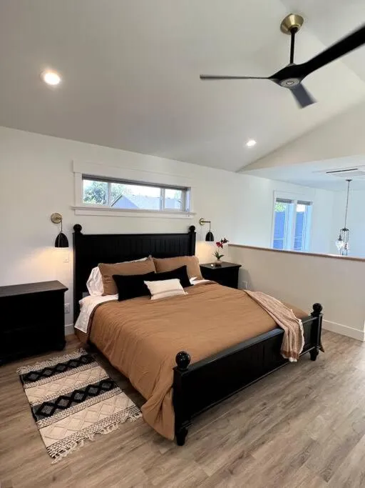 fireplace, Bed in Custom Built Cottage in Downtown with Pool