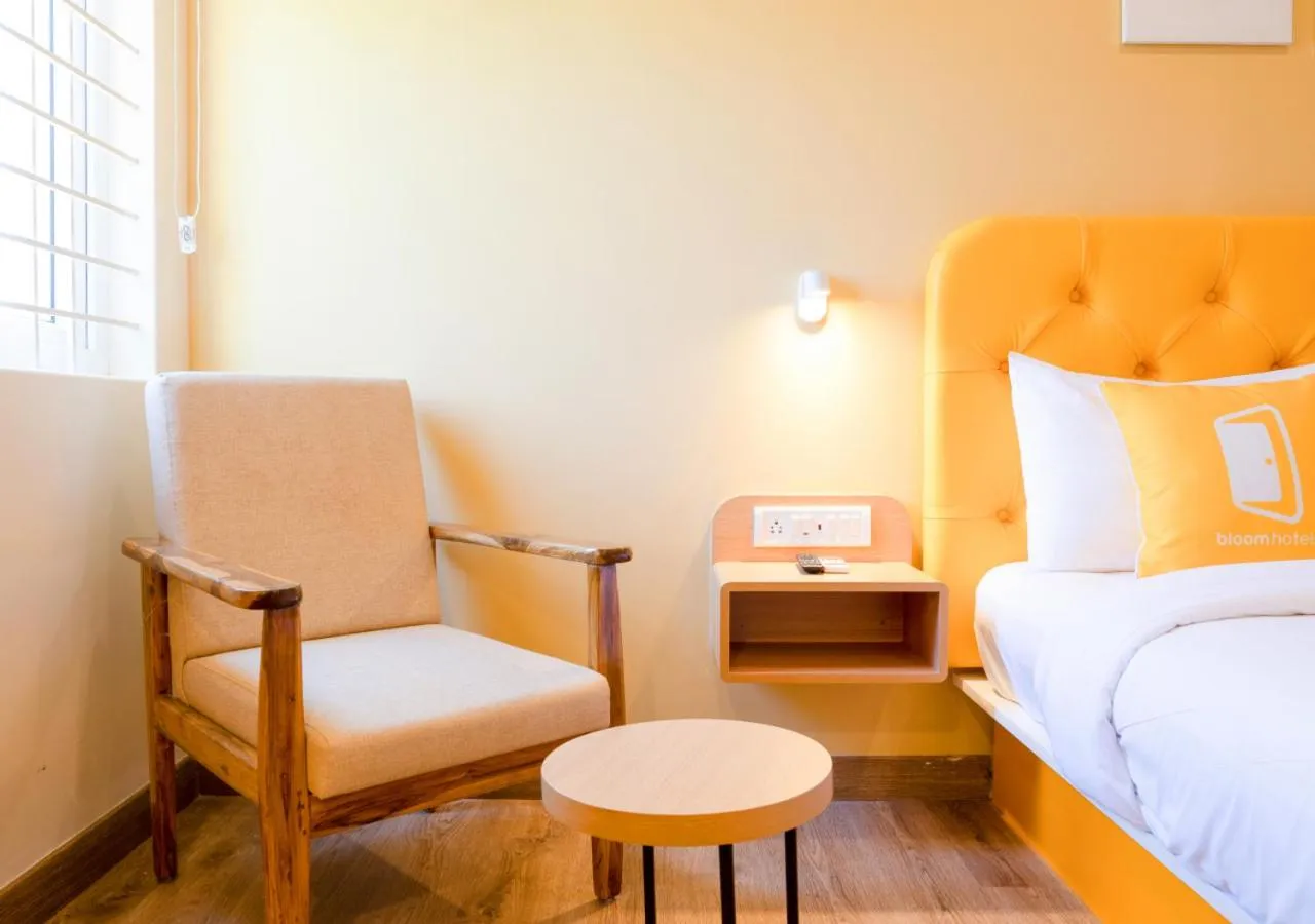 Seating area, Bed in Bloom Hotel - HSR Layout Sector 3