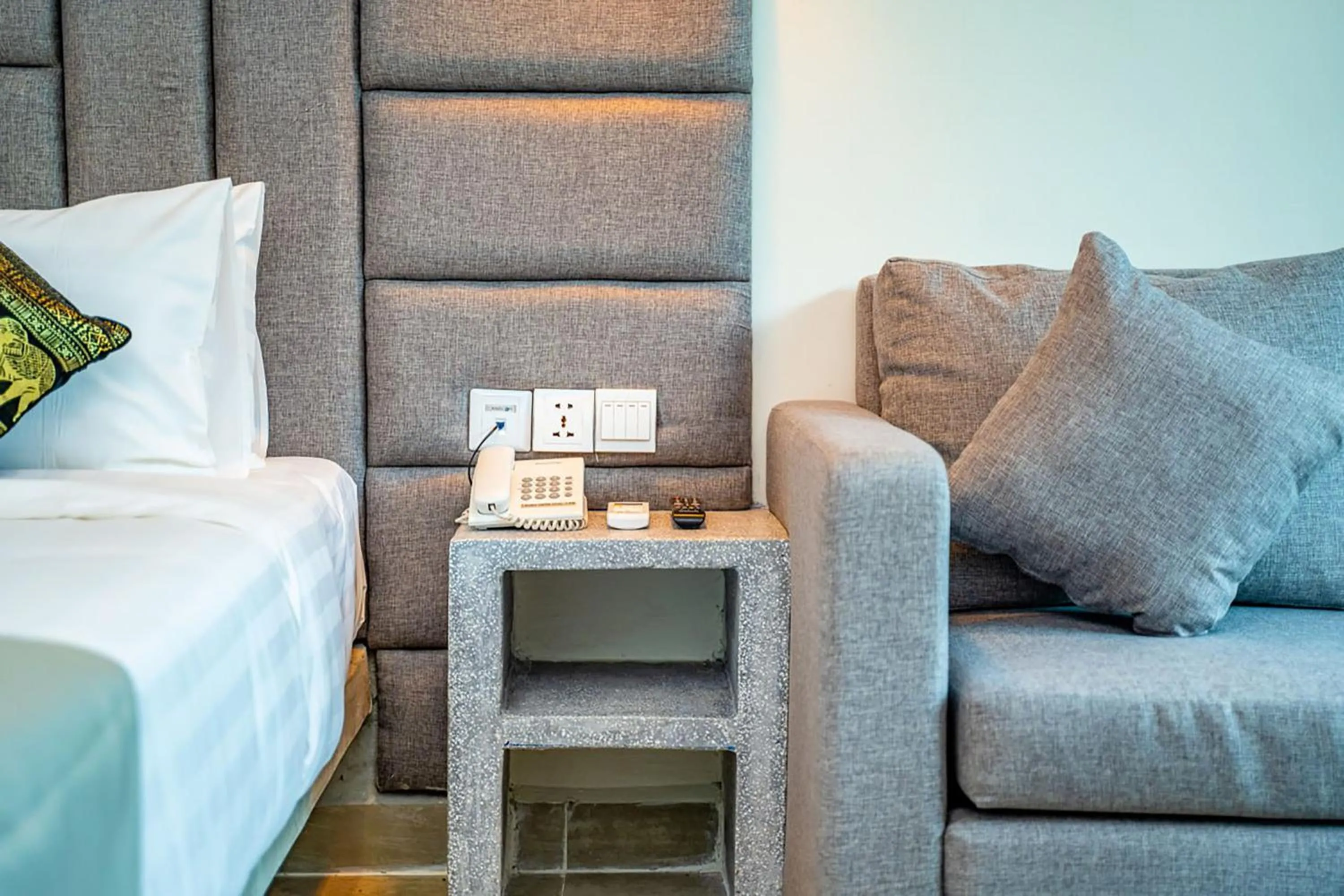 Seating area, Bed in Rainforest Hotel by NSUN