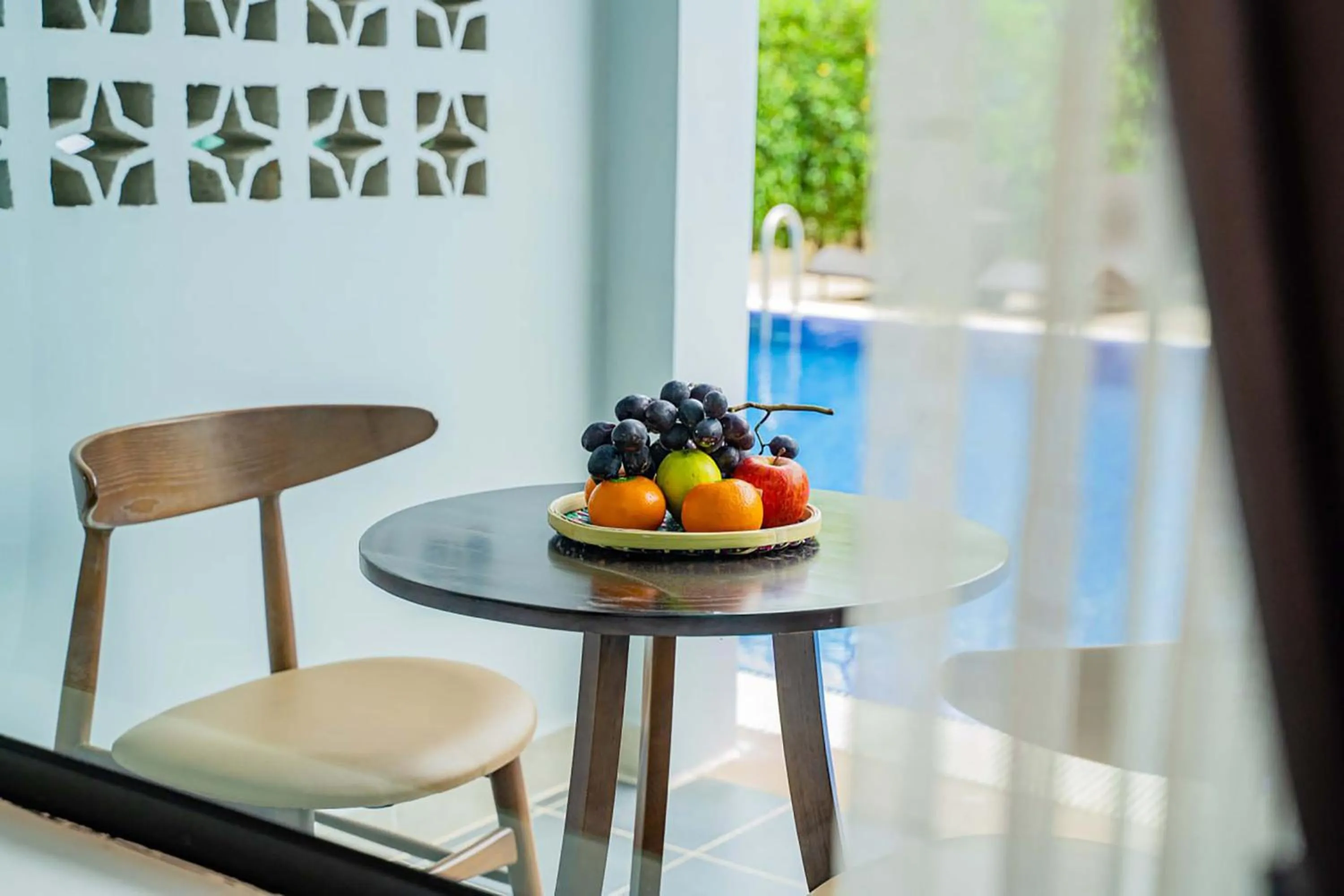 Seating area in Rainforest Hotel by NSUN