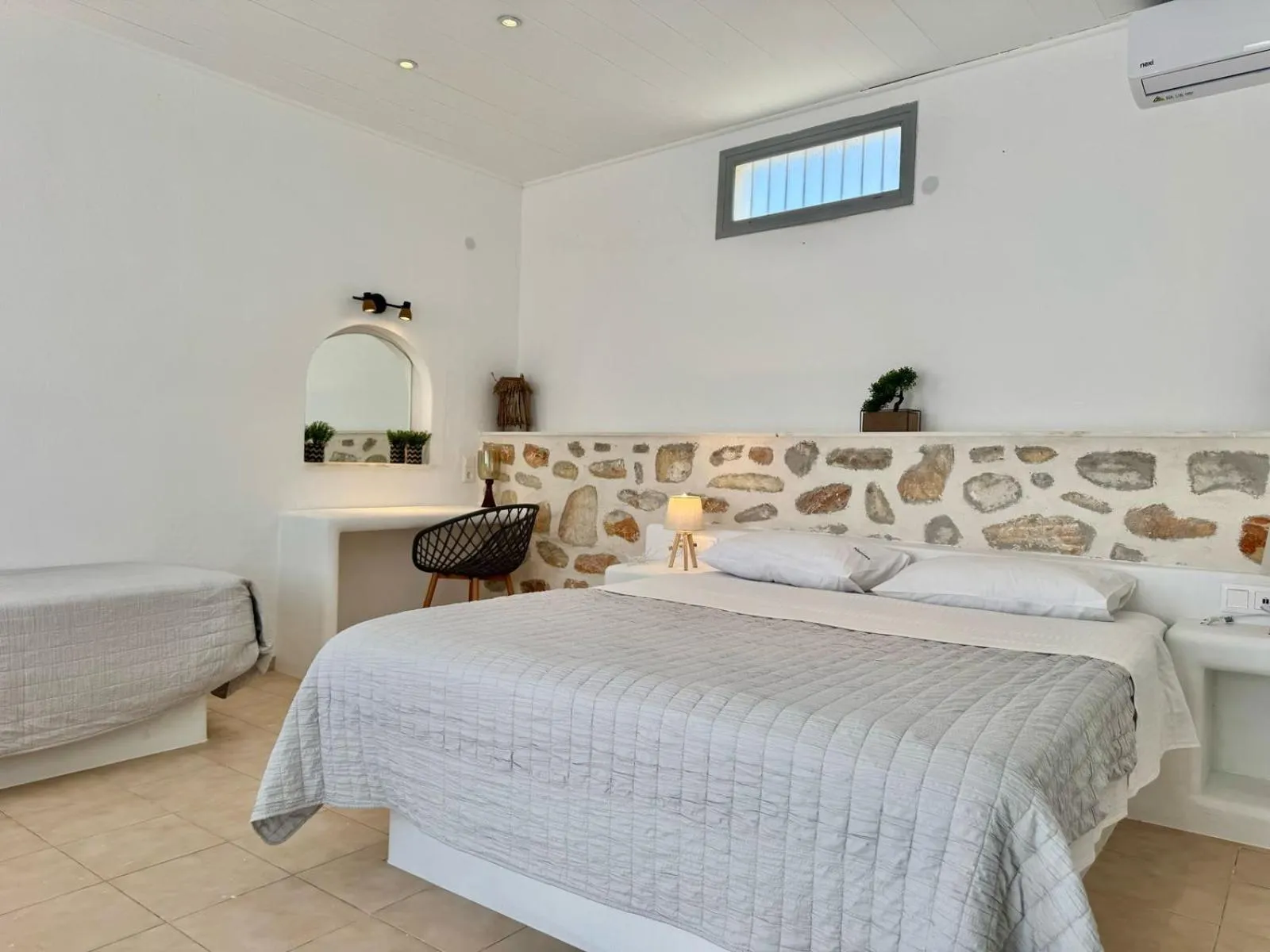 Photo of the whole room, Bed in Naoussa Hotel Paros by Booking Kottas