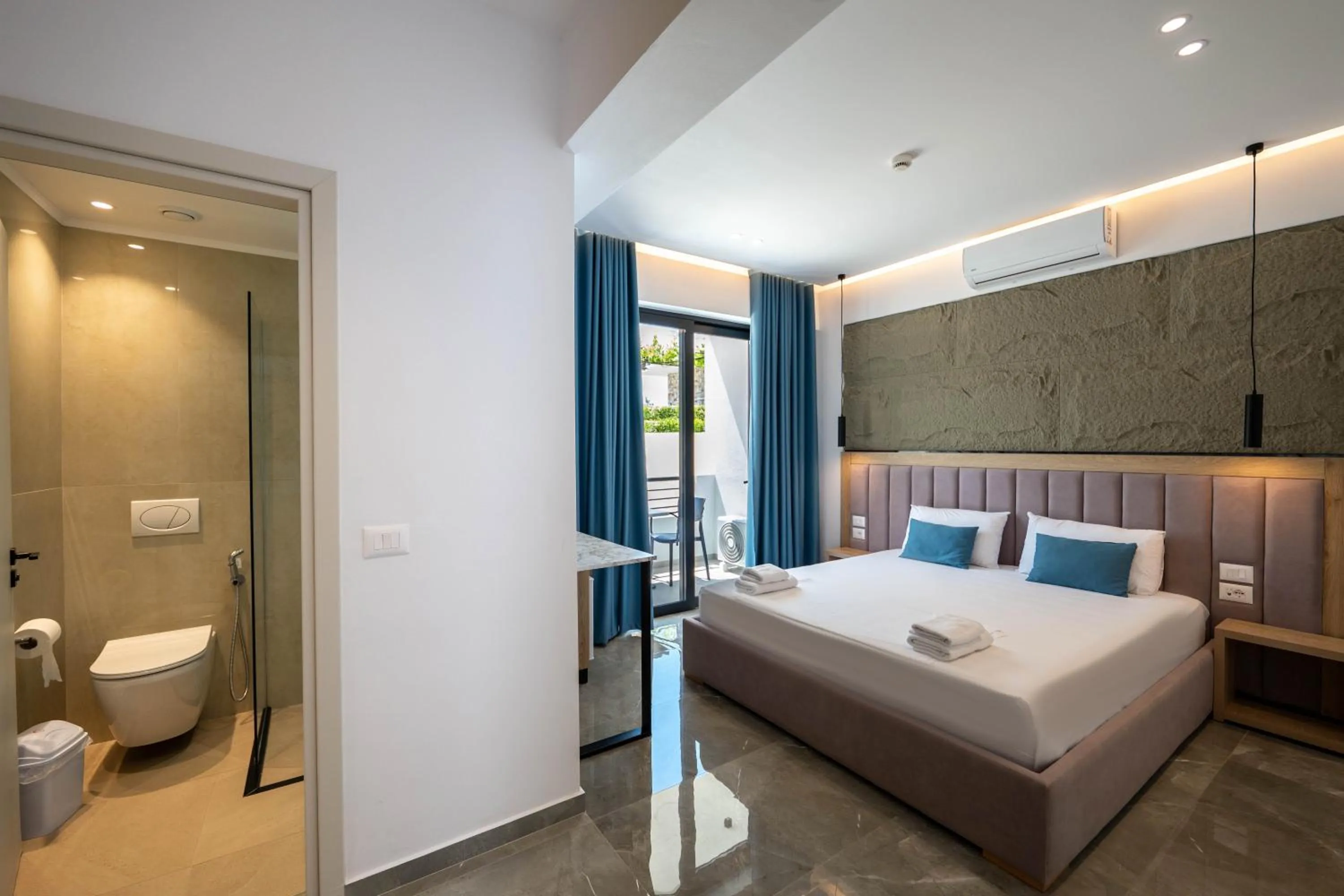 Toilet, Bed in Monel Hotel