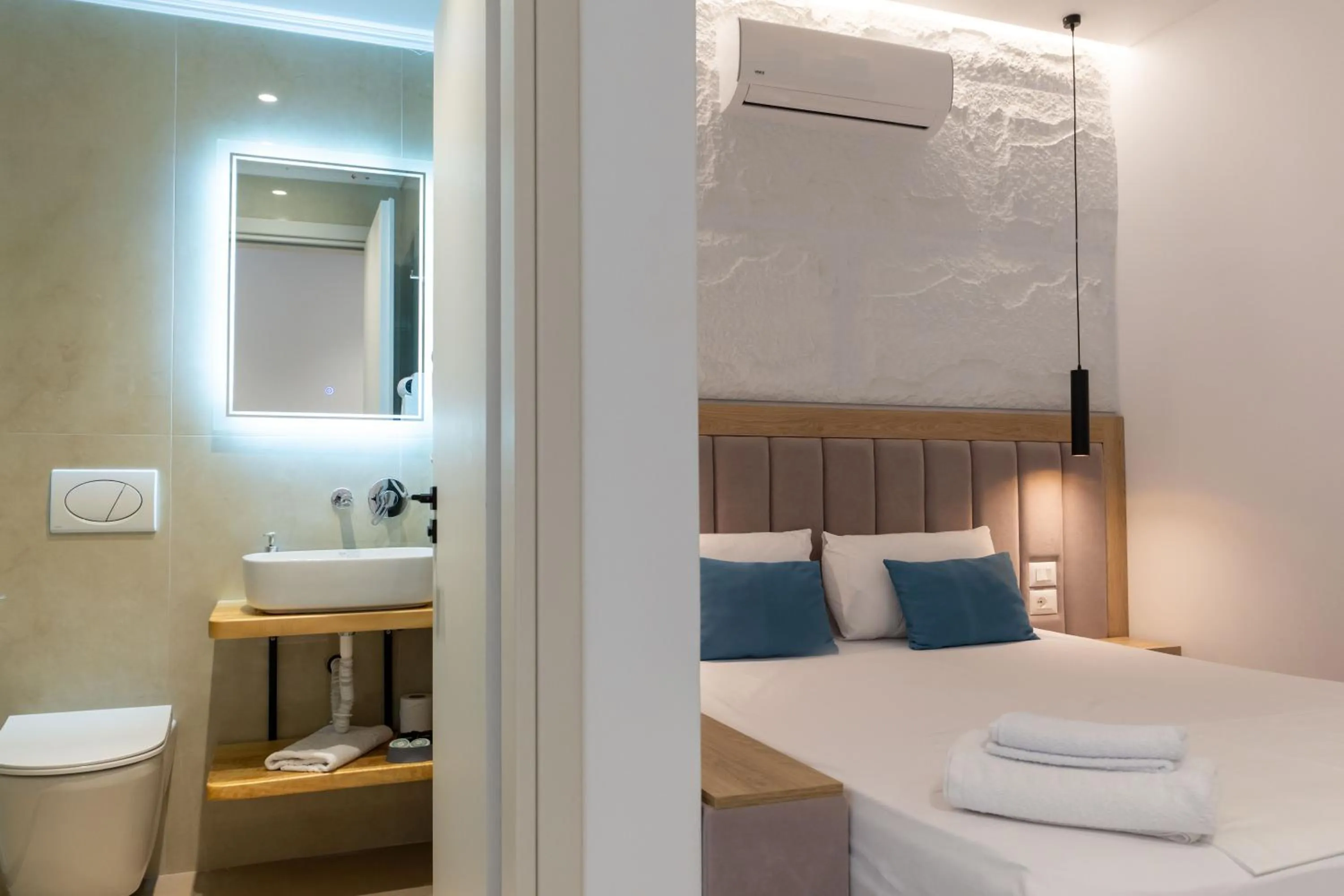 Toilet, Bed in Monel Hotel