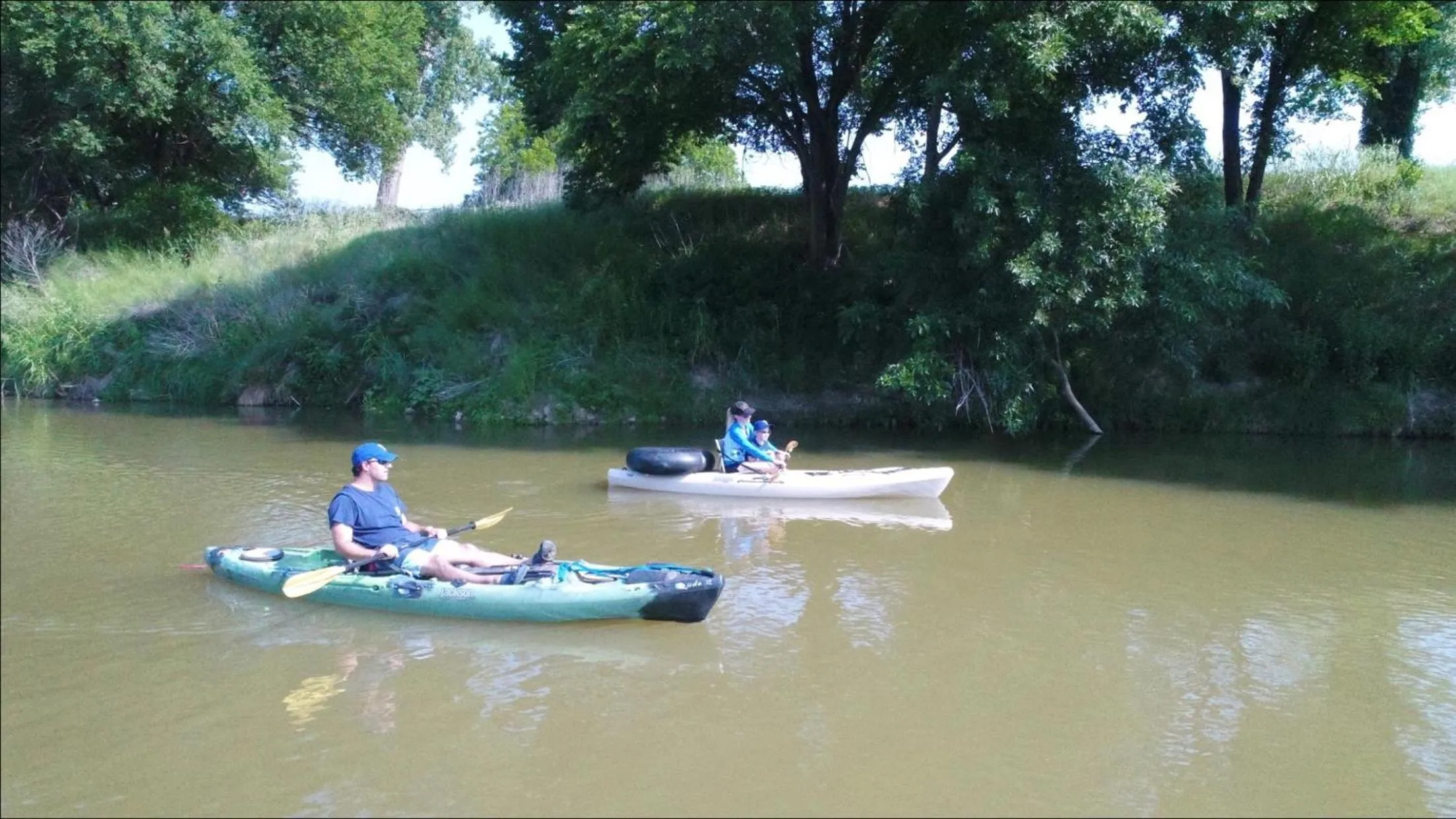 People in "Magical Treehouse" w spiral slide off the deck 350 acres on the Brazos River! Tubing! Petting Zoo!
