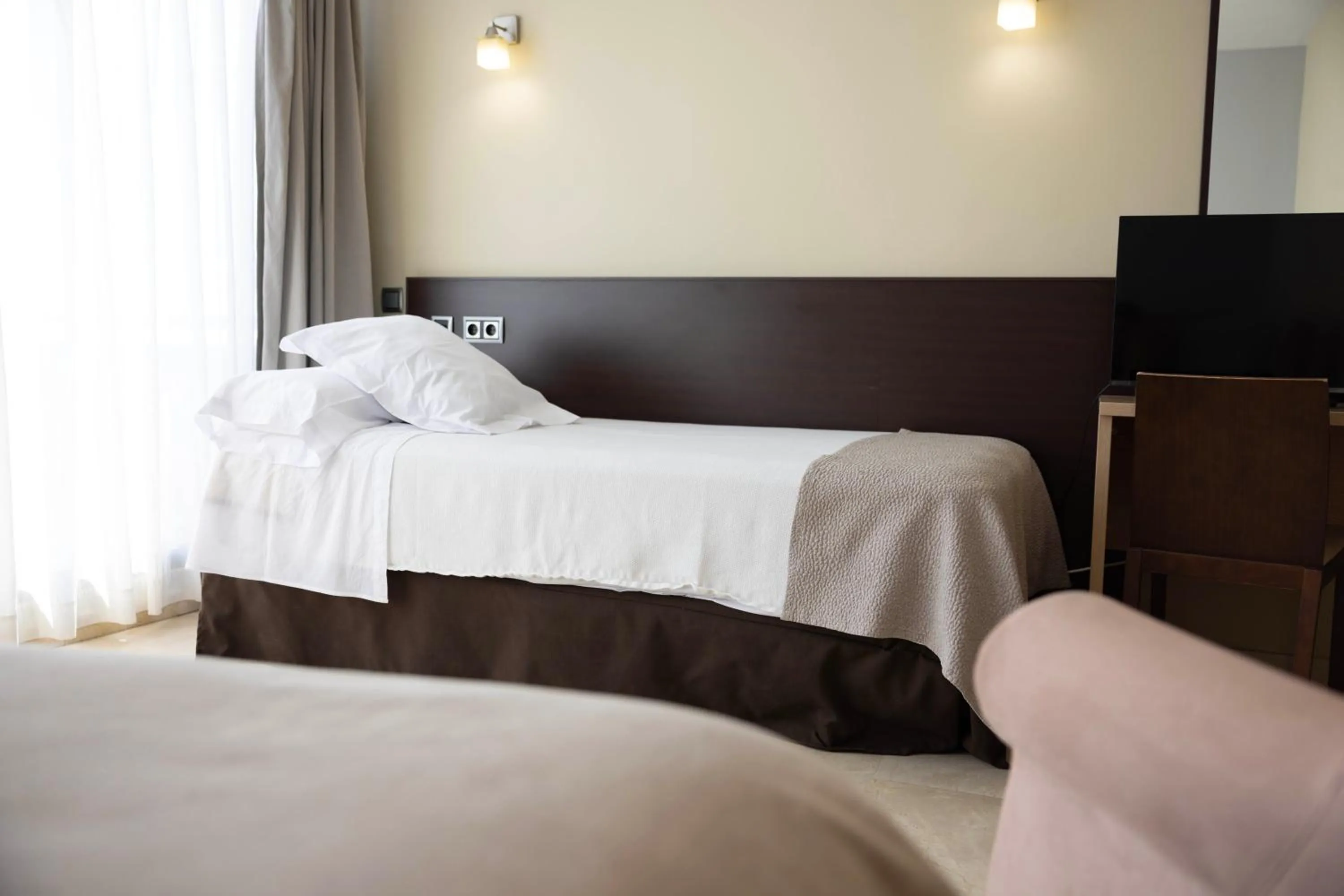 Bed in Hotel Flamingo