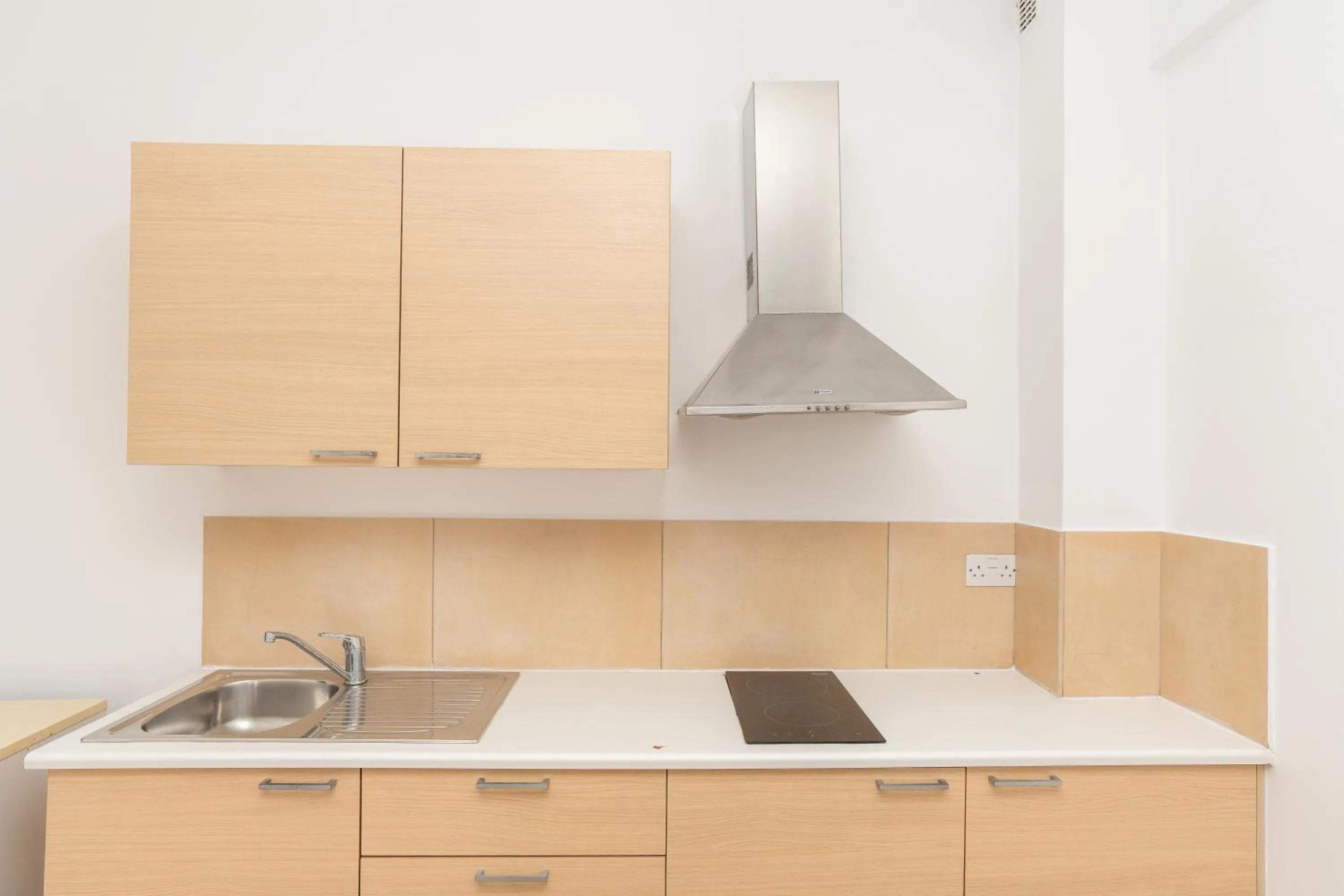 Kitchen or kitchenette in Flora Hotel Apartments