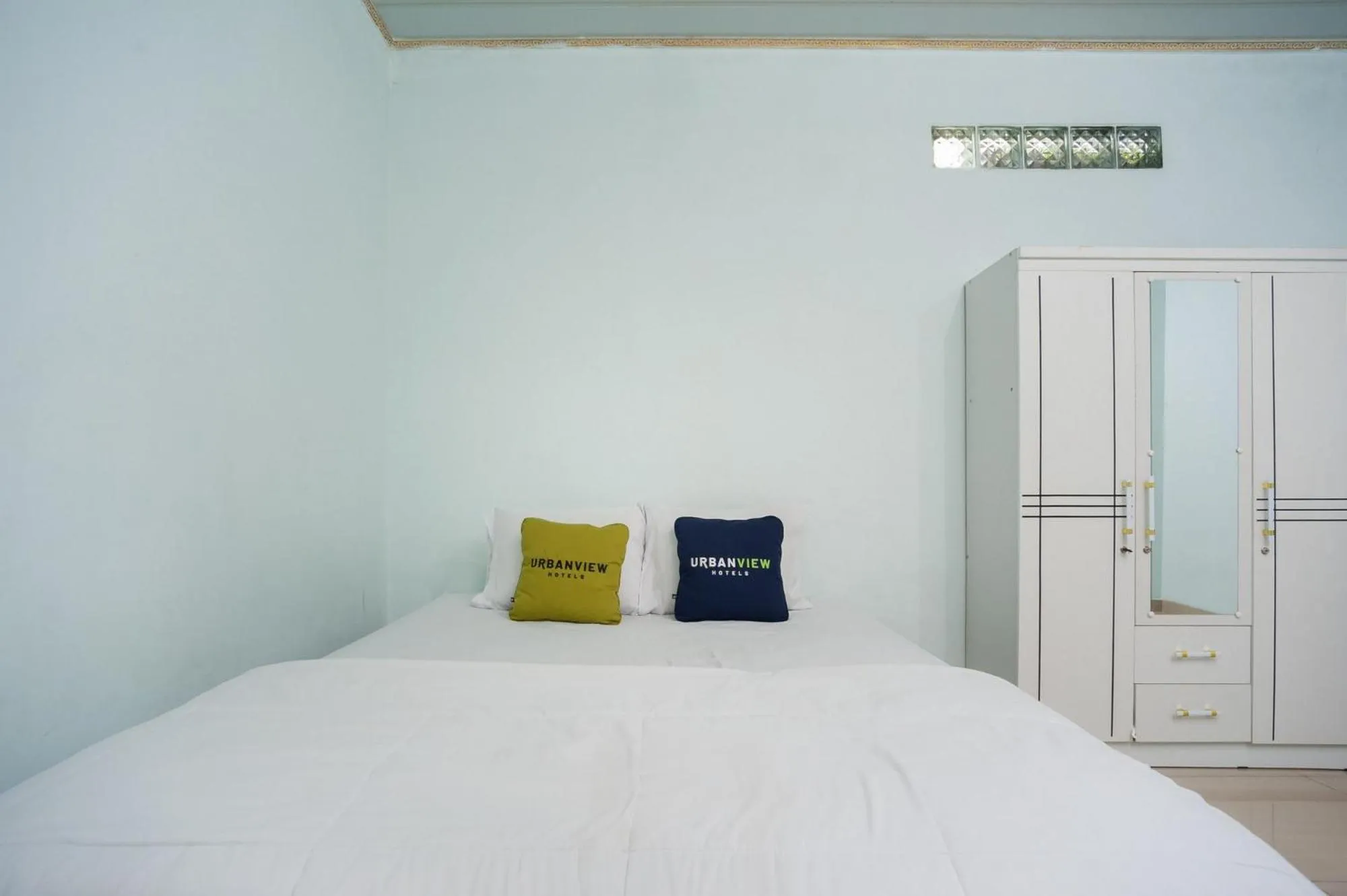 Bed in Urbanview My Home Ciracas by RedDoorz